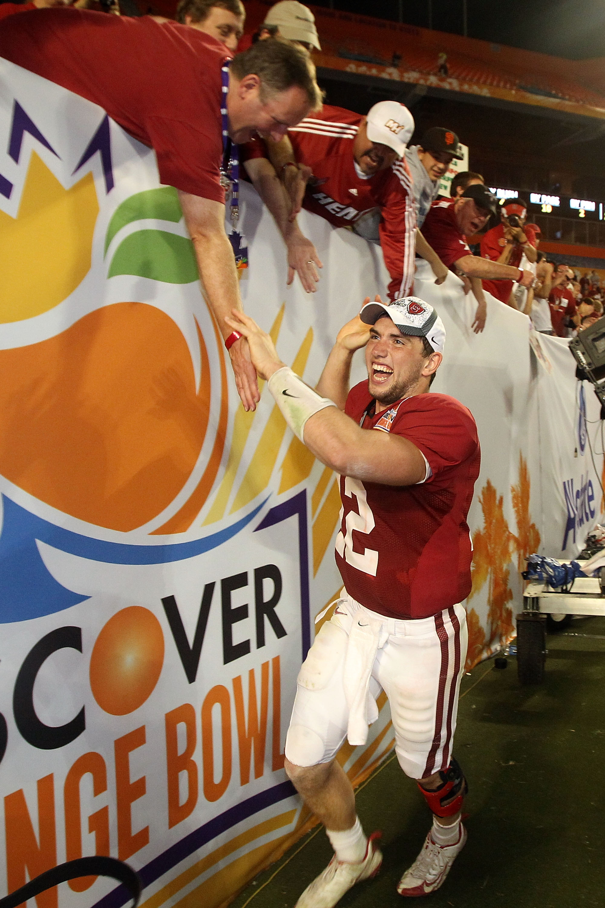 MIAMI, FL - JANUARY 03:  Orange Bowl MVP Andrew Luck of the Stanford Cardinal celebrates with fans after Stanford won 40-14 against the Virginia Tech Hokies during the 2011 Discover Orange Bowl at Sun Life Stadium on January 3, 2011 in Miami, Florida.  (P