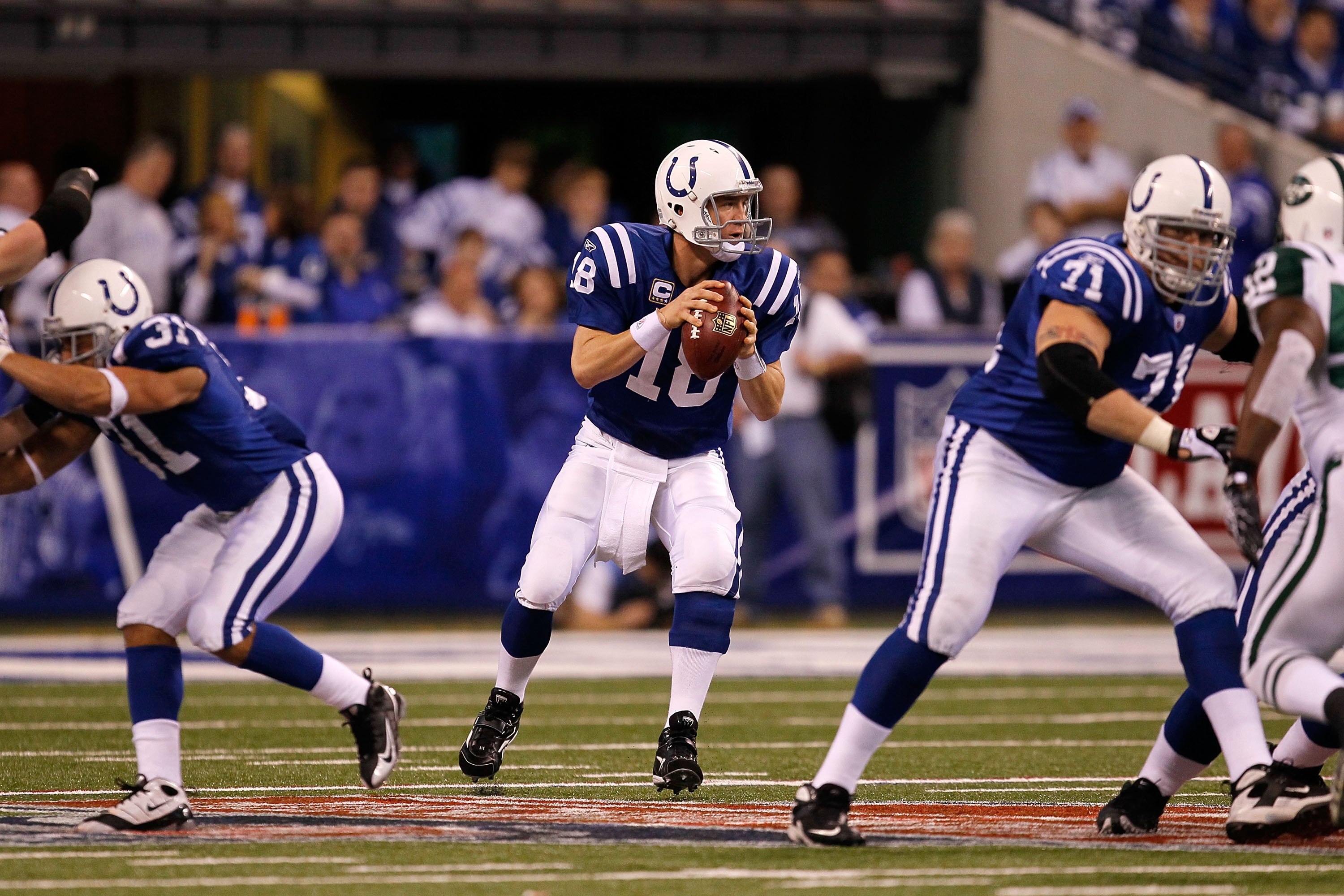 INDIANAPOLIS - JANUARY 24:  Quarterback Peyton Manning #18 of the Indianapolis Colts looks to pass while playing against the New York Jets during the first half of the AFC Championship Game at Lucas Oil Stadium on January 24, 2010 in Indianapolis, Indiana