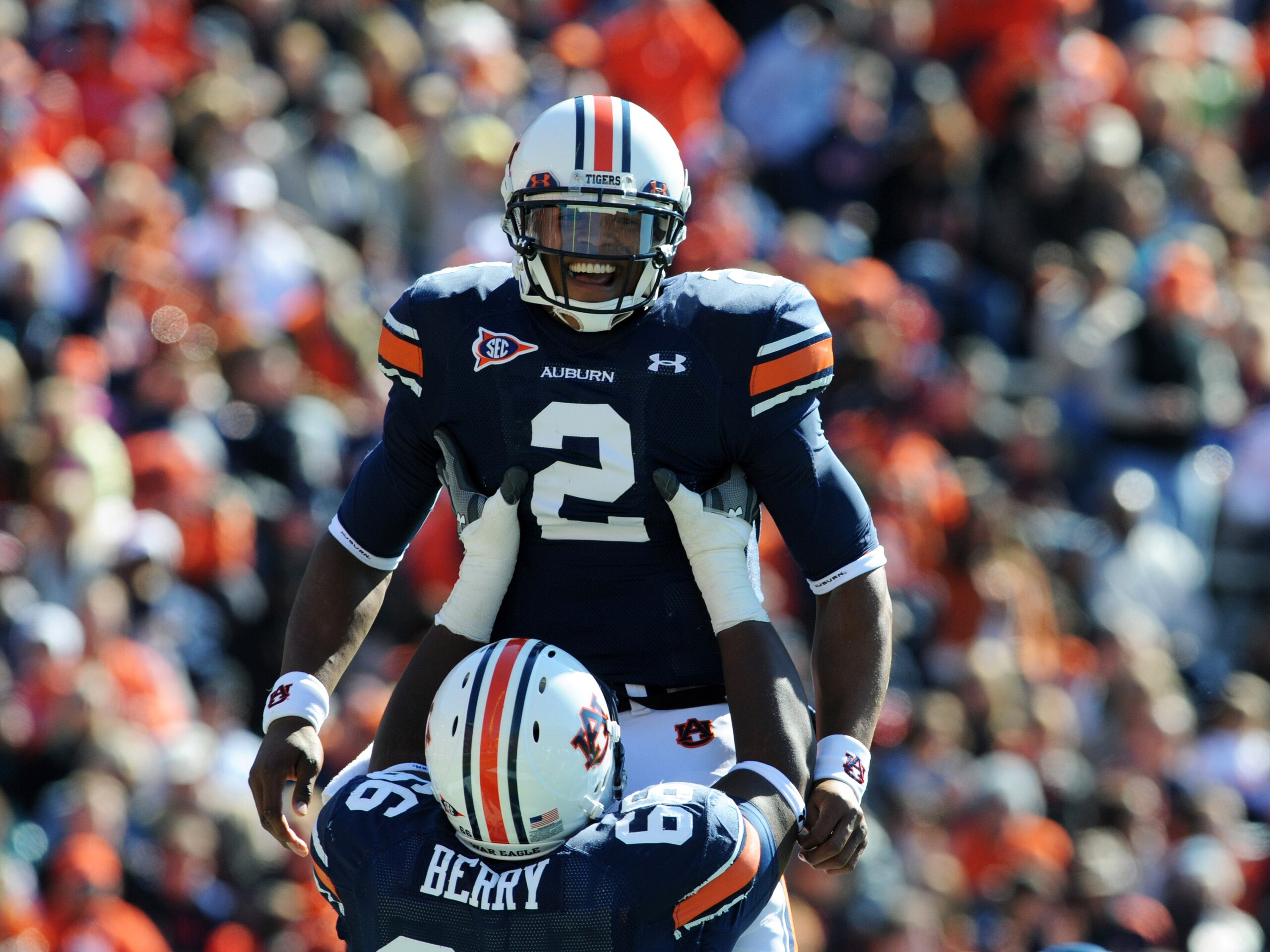 AUBURN, AL - NOVEMBER 6:  Quarterback Cam Newton #2 of the Auburn Tigers celebrates a touchdown run against the Chattanooga Mocs November 6, 2010 at Jordan-Hare Stadium in Auburn, Alabama.  (Photo by Al Messerschmidt/Getty Images)