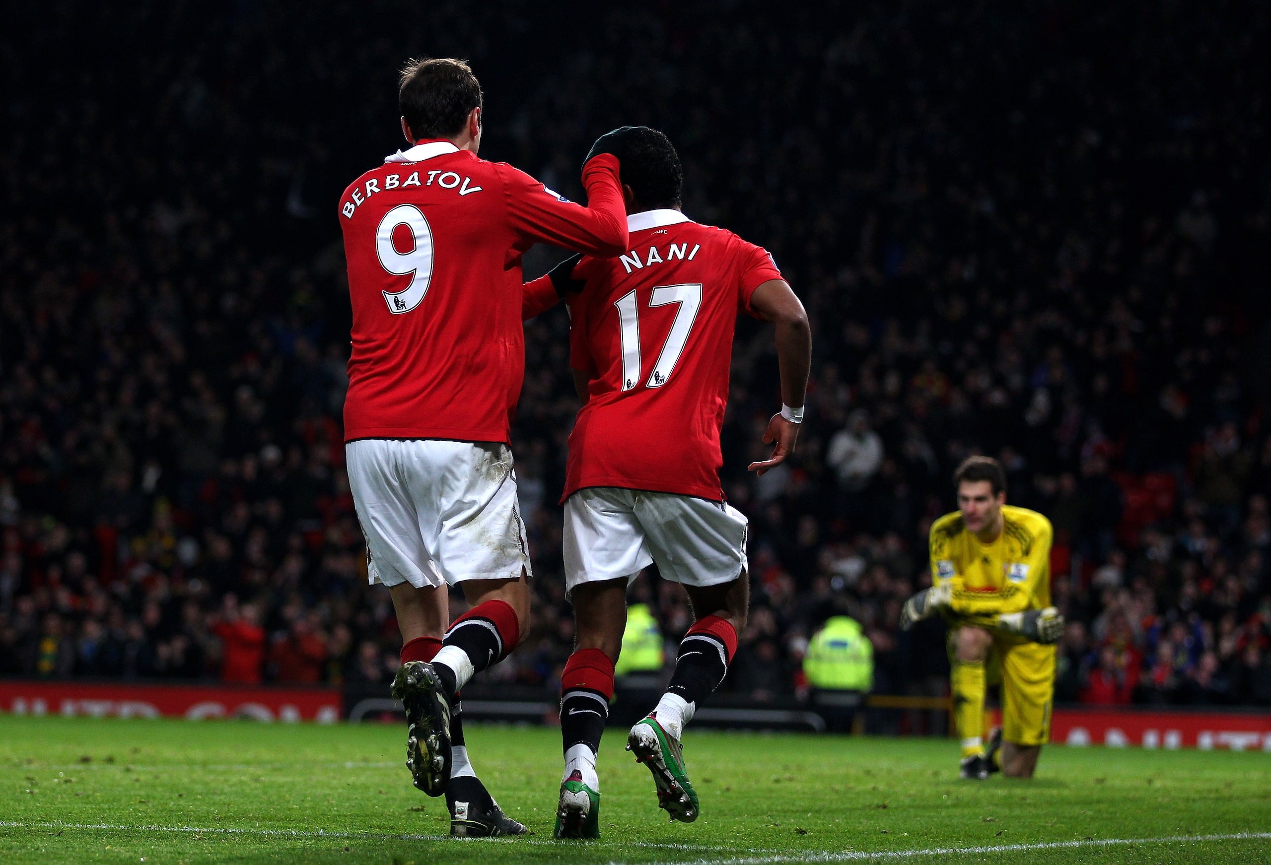 MANCHESTER, ENGLAND - JANUARY 04:  Nani of Manchester United celebrates scoring his team's second goal with team mate Dimitar Berbatov during the Barclays Premier League match between Manchester United and Stoke City at Old Trafford on January 4, 2011 in