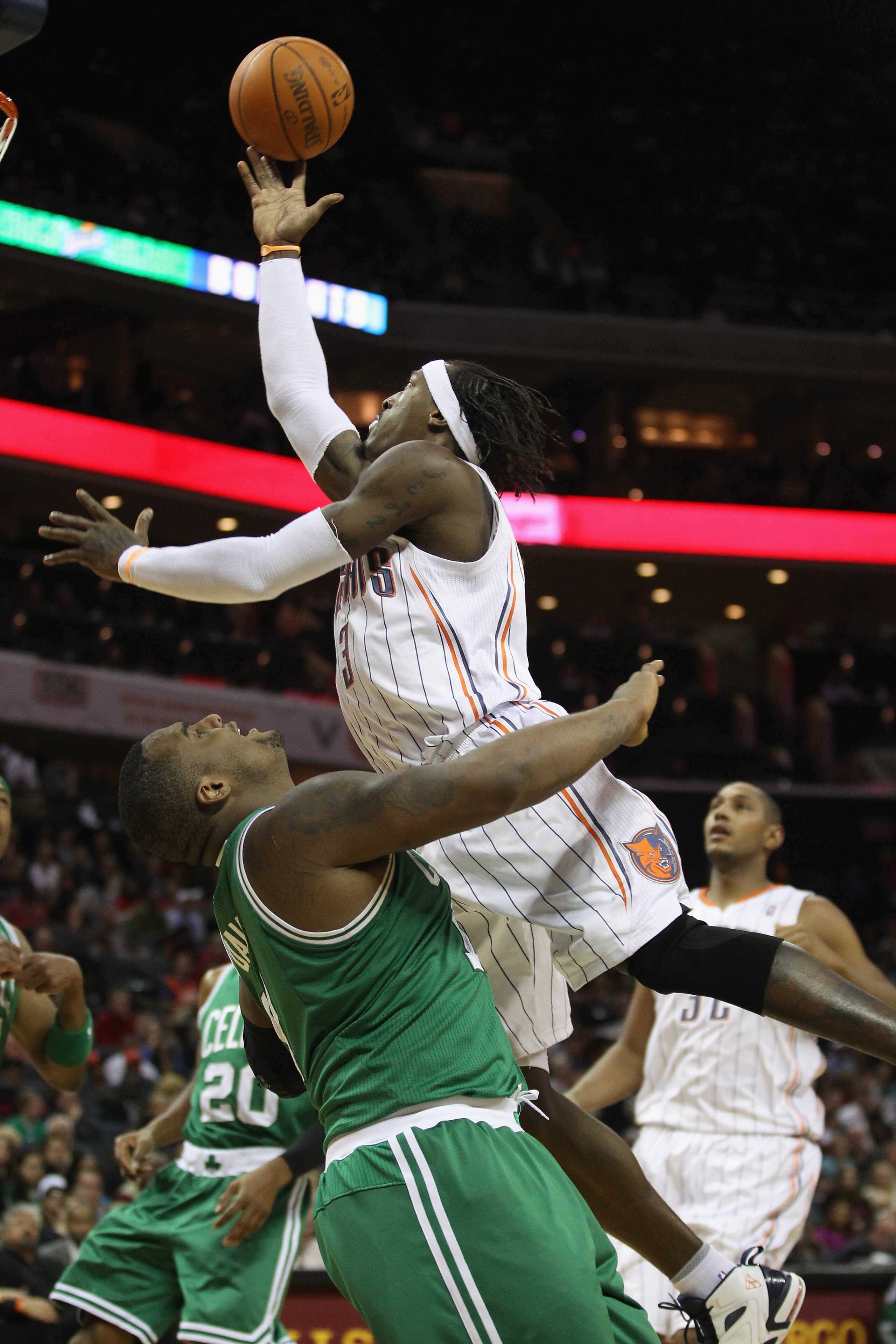 CHARLOTTE, NC - DECEMBER 11:  Glen Davis #11 of the Boston Celtics tries to stop Gerald Wallace #3 of the Charlotte Bobcats during their game at Time Warner Cable Arena on December 11, 2010 in Charlotte, North Carolina. NOTE TO USER: User expressly acknow