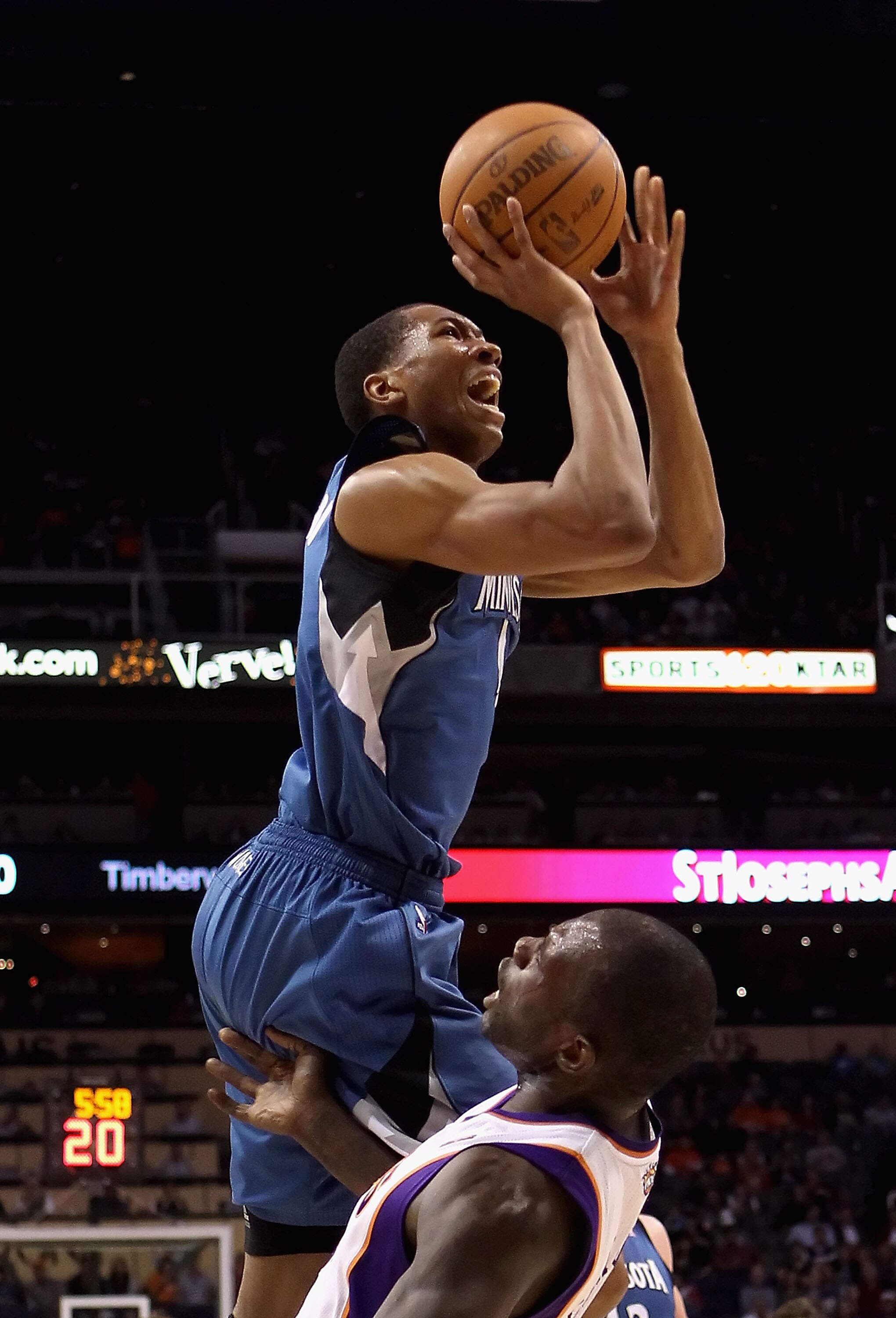 PHOENIX - DECEMBER 15:  Wesley Johnson #4 of the Minnesota Timberwolves drives to the basket over Grant Hill #13 of the Phoenix Suns during the NBA game at US Airways Center on December 15, 2010 in Phoenix, Arizona. The Suns defeated the Timberwolves 128-