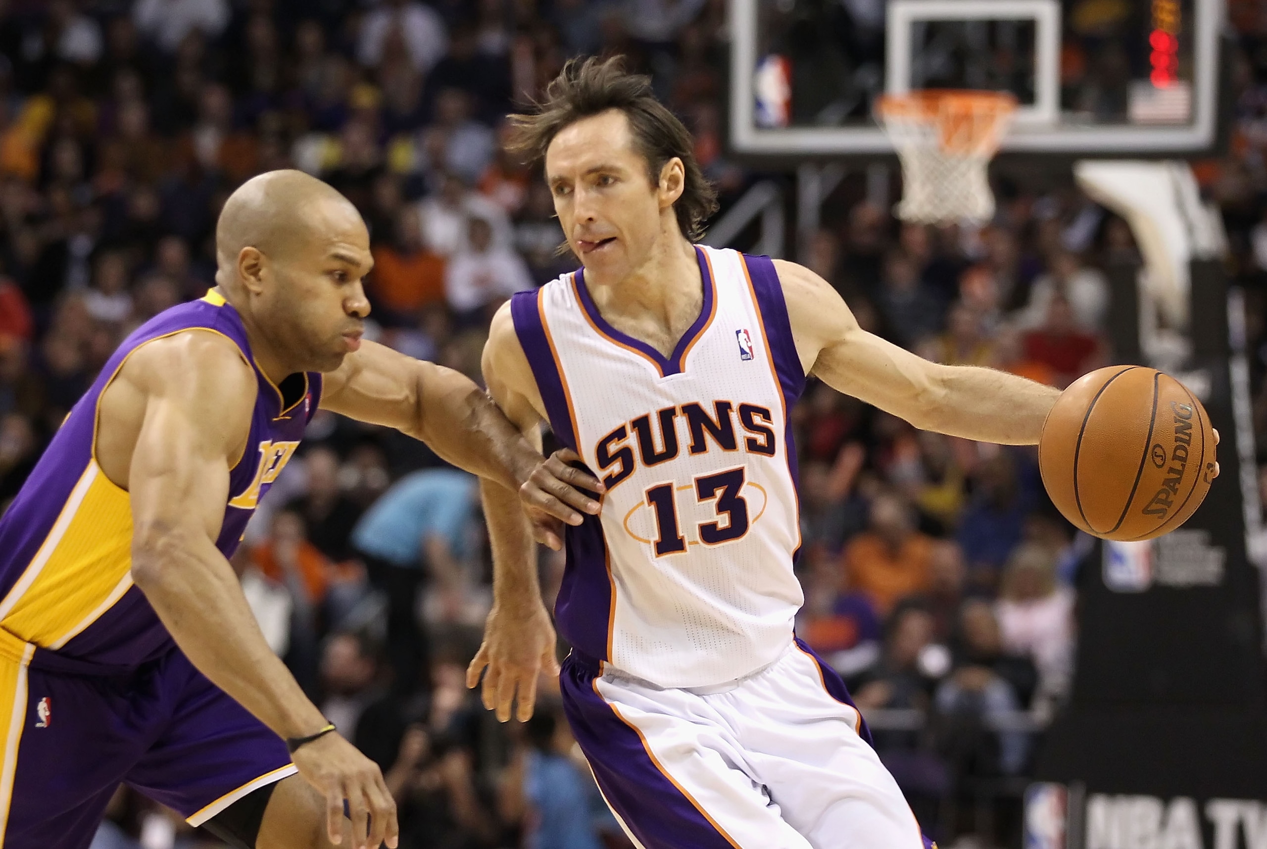 PHOENIX - JANUARY 05: Steve Nash #13 of the Phoenix Suns handles the ball under pressure from Derek Fisher #2 of the Los Angeles Lakers during the NBA game at US Airways Center on December 23, 2011 in Phoenix, Arizona. NOTE TO USER: User expressly acknow PHOENIX - JANUARY 05: Steve Nash #13 of the Phoenix Suns handles the ball under pressure from Derek Fisher #2 of the Los Angeles Lakers during the NBA game at US Airways Center on December 23, 2011 in Phoenix, Arizona. NOTE TO USER: User expressly acknow