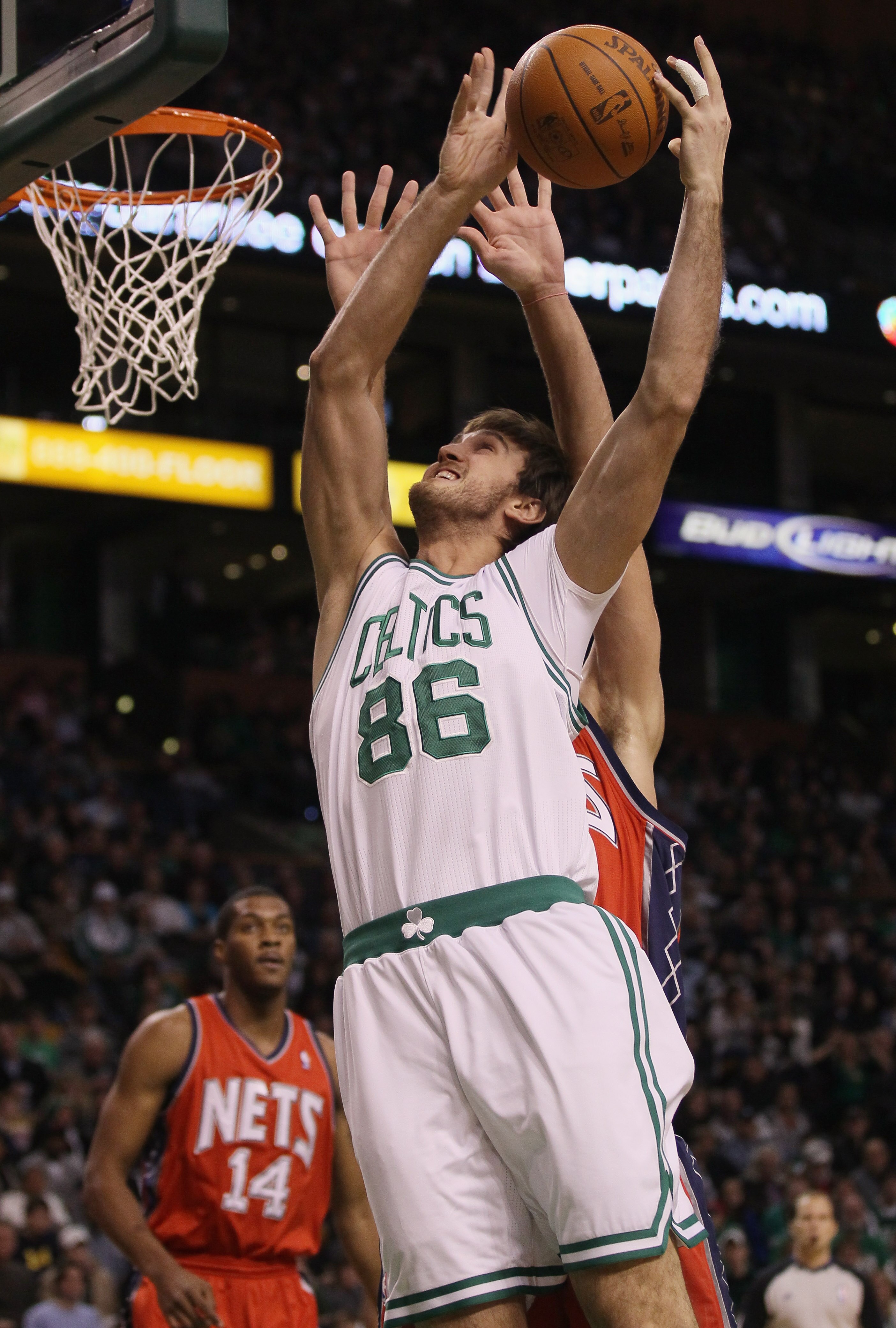 BOSTON - NOVEMBER 24:  Semih Erden #86 of the Boston Celtics tries to take a shot in the first half against the New Jersey Nets on November 24, 2010 at the TD Garden in Boston, Massachusetts. NOTE TO USER: User expressly acknowledges and agrees that, by d