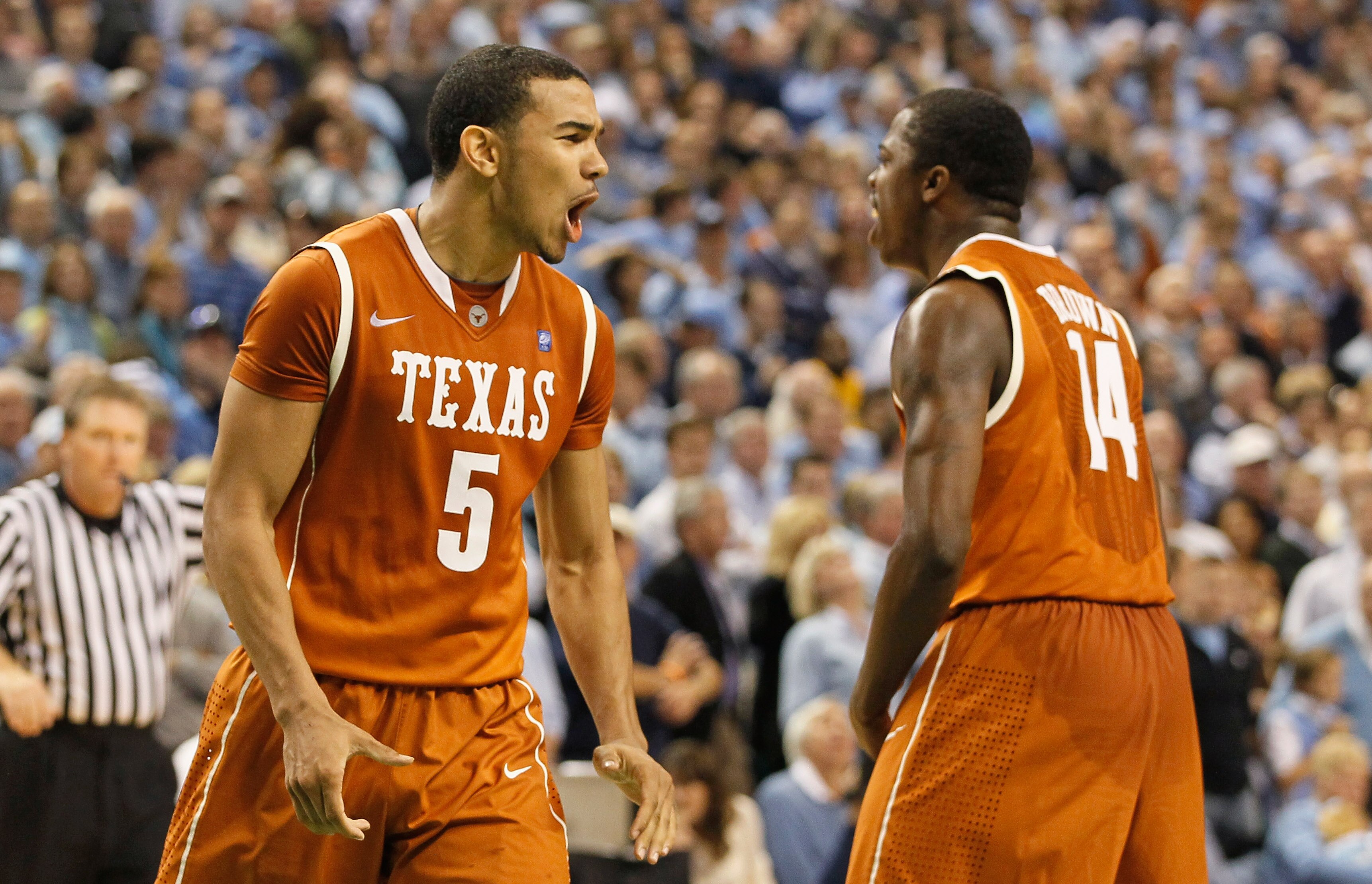 GREENSBORO, NC - DECEMBER 18:  Cory Joseph #5 of the Texas Longhorns reacts with J'Covan Brown #14 after Joseph hit what became the game-winning basket against the North Carolina Tar Heels Greensboro Coliseum on December 18, 2010 in Greensboro, North Caro