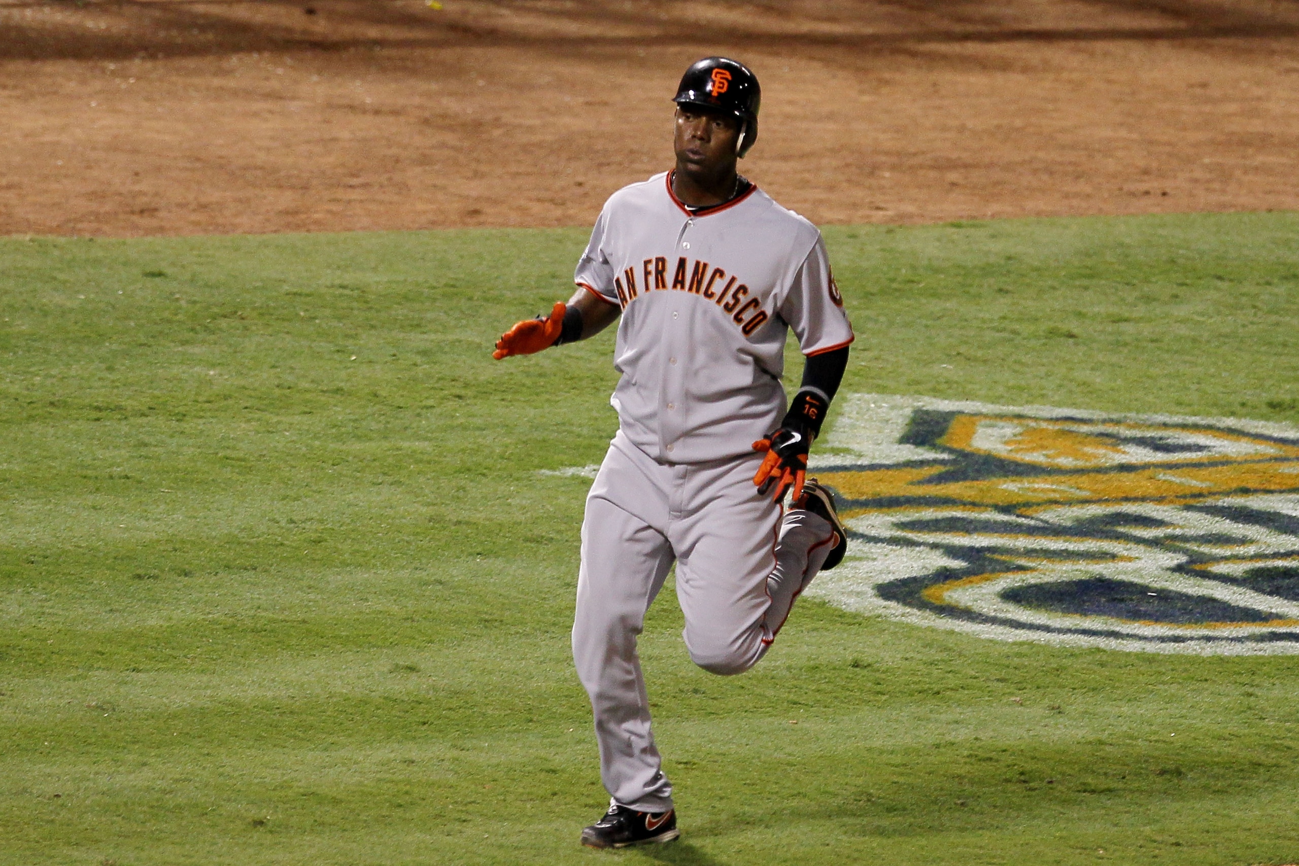 ARLINGTON, TX - OCTOBER 31:  Edgar Renteria #16 of the San Francisco Giants rounds third base as he scores in the seventh inning against the Texas Rangers in Game Four of the 2010 MLB World Series at Rangers Ballpark in Arlington on October 31, 2010 in Ar