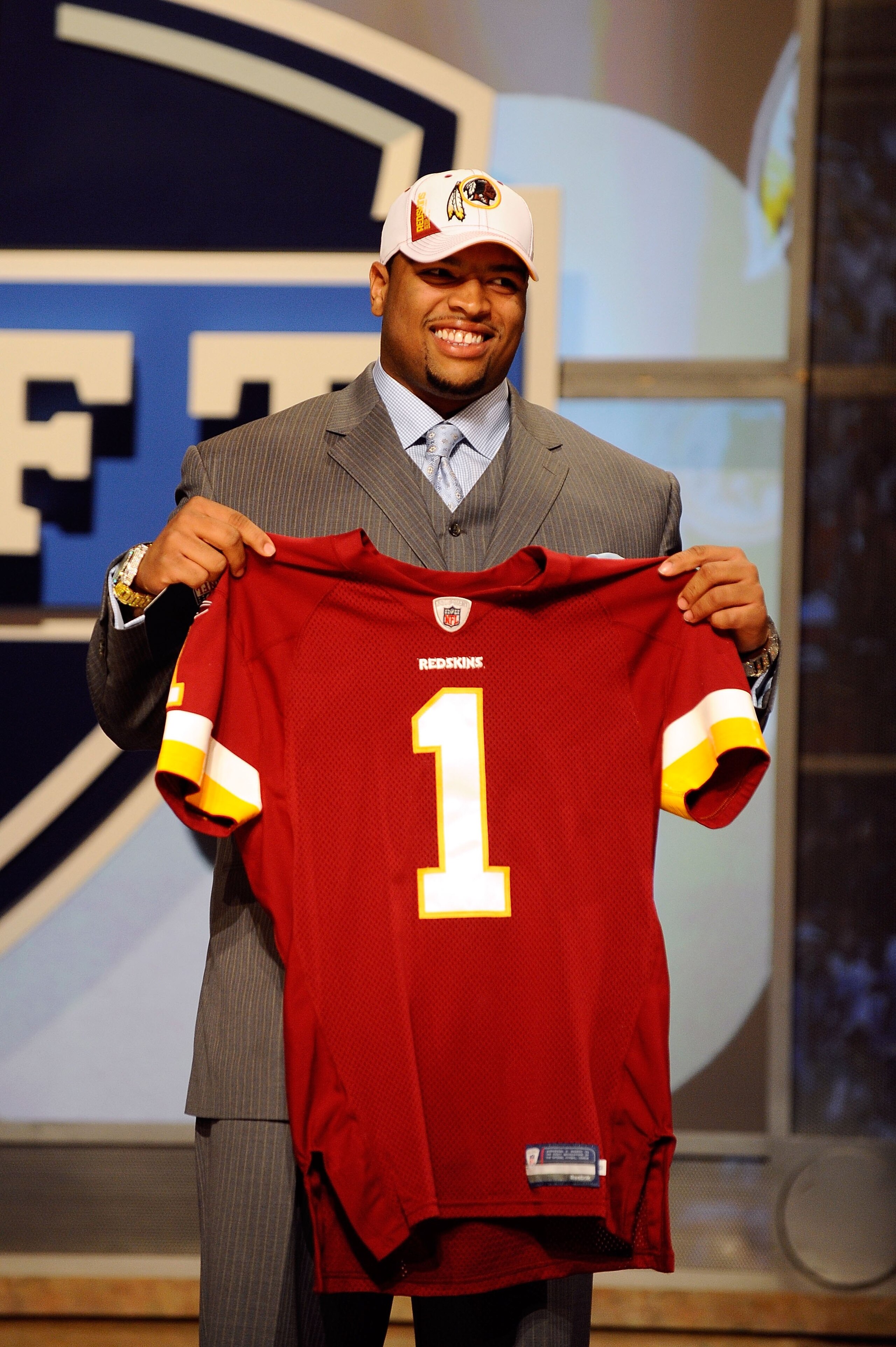 NEW YORK - APRIL 22: Trent Williams from the Oklahoma Sooners holds a Washington Redskins jersey after Washington selected Williams number 4 overall during the first round of the 2010 NFL Draft at Radio City Music Hall on April 22, 2010 in New York City. NEW YORK - APRIL 22: Trent Williams from the Oklahoma Sooners holds a Washington Redskins jersey after Washington selected Williams number 4 overall during the first round of the 2010 NFL Draft at Radio City Music Hall on April 22, 2010 in New York City.