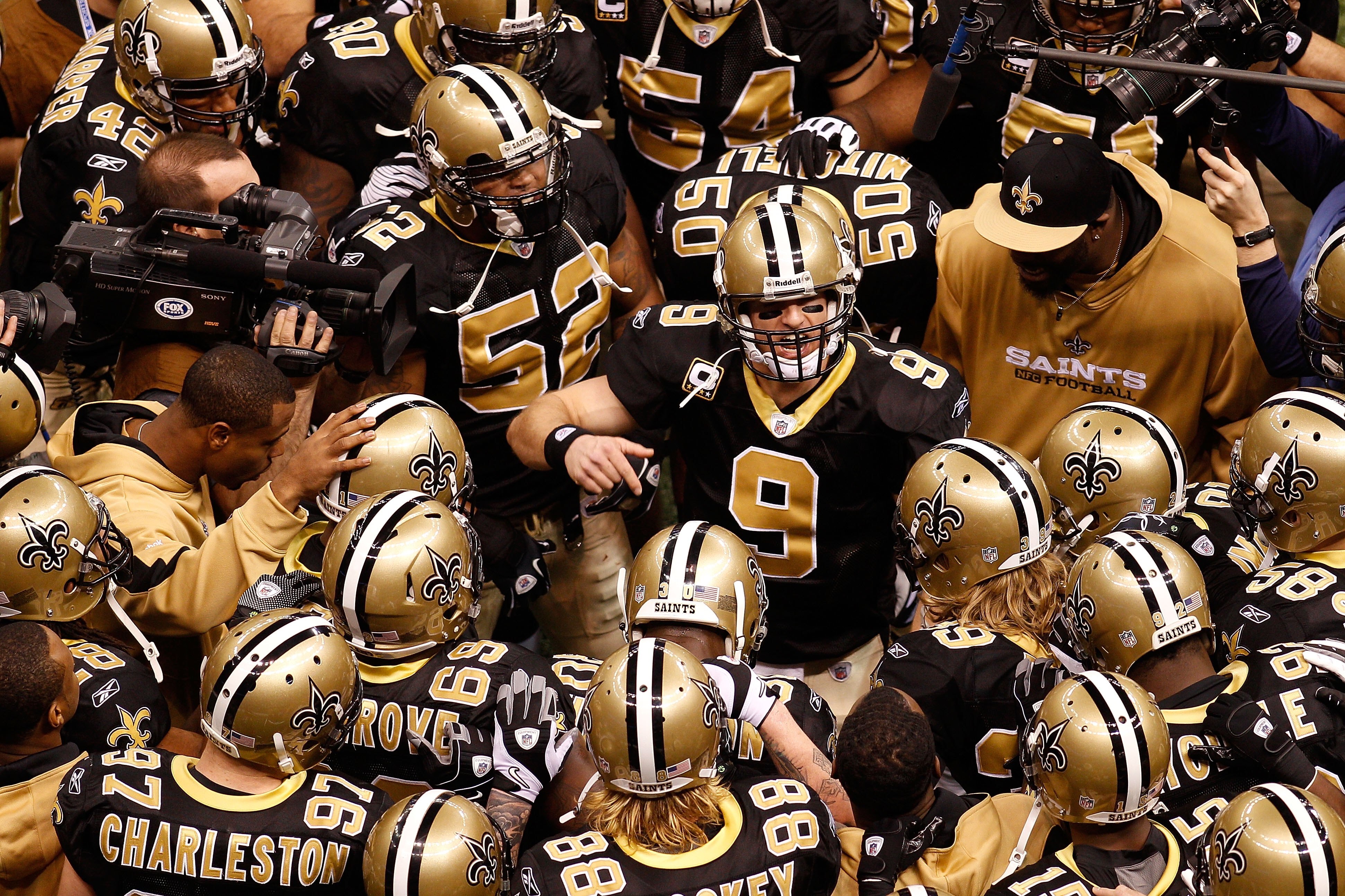 NEW ORLEANS - JANUARY 24:  Quarterback Drew Brees #9 of the New Orleans Saints addresses his teammates prior to playing against the Minnesota Vikings during the NFC Championship Game at the Louisiana Superdome on January 24, 2010 in New Orleans, Louisiana