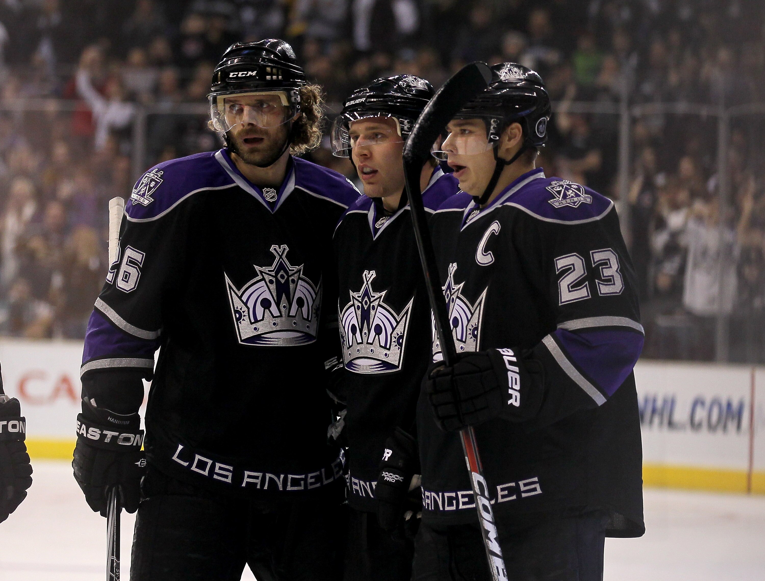 LOS ANGELES, CA - DECEMBER 30:  Jack Johnson #3 (C) of the Los Angeles Kings celebrates his goal with Michal Handzus #26 and Dustin Brown #23 against the Philadelphia Flyers at Staples Center on December 30, 2010 in Los Angeles, California.   The Flyers w