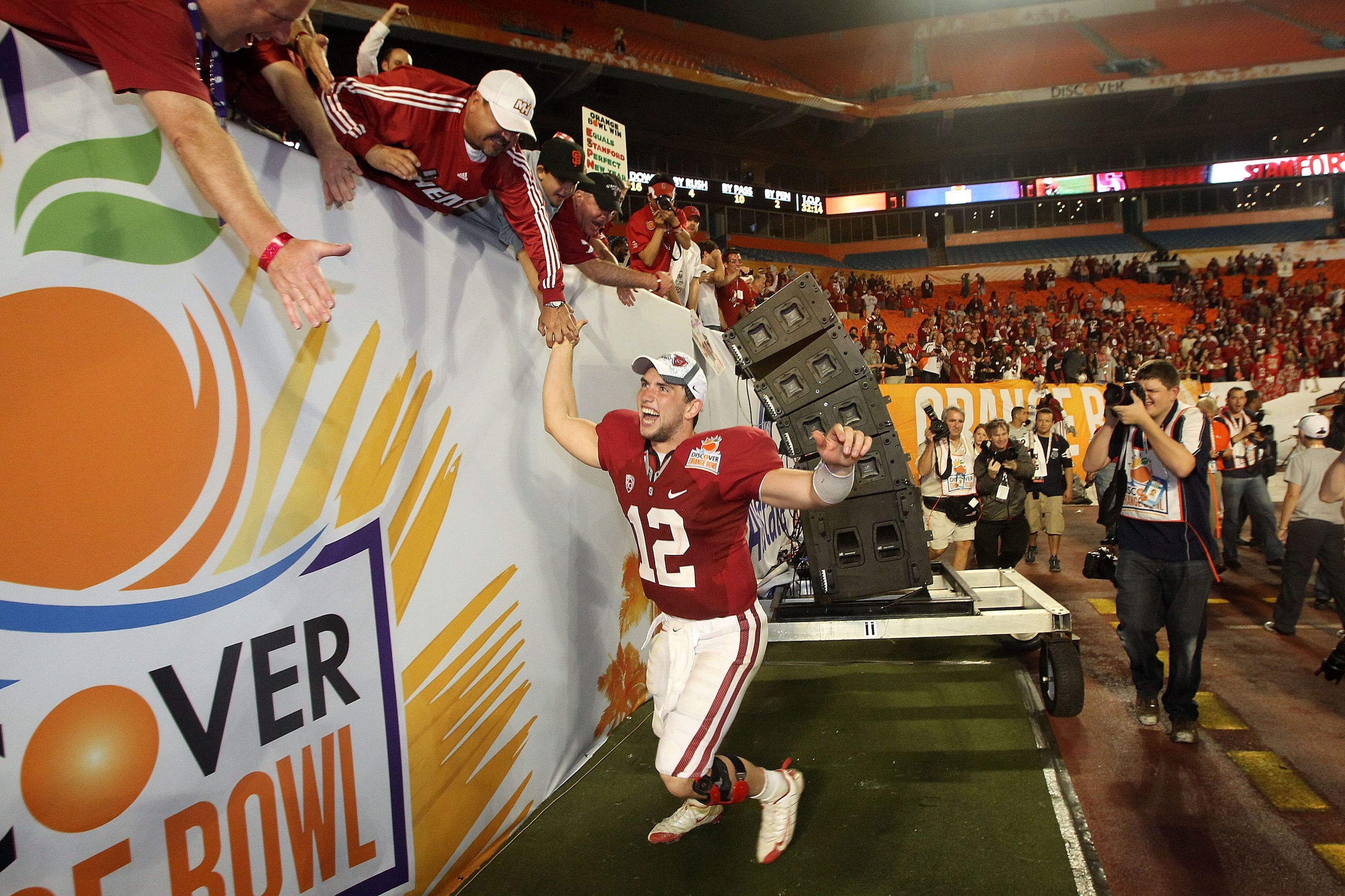 MIAMI, FL - JANUARY 03:  Orange Bowl MVP Andrew Luck of the Stanford Cardinal celebrates with fans after Stanford won 40-14 against the Virginia Tech Hokies during the 2011 Discover Orange Bowl at Sun Life Stadium on January 3, 2011 in Miami, Florida.  (P