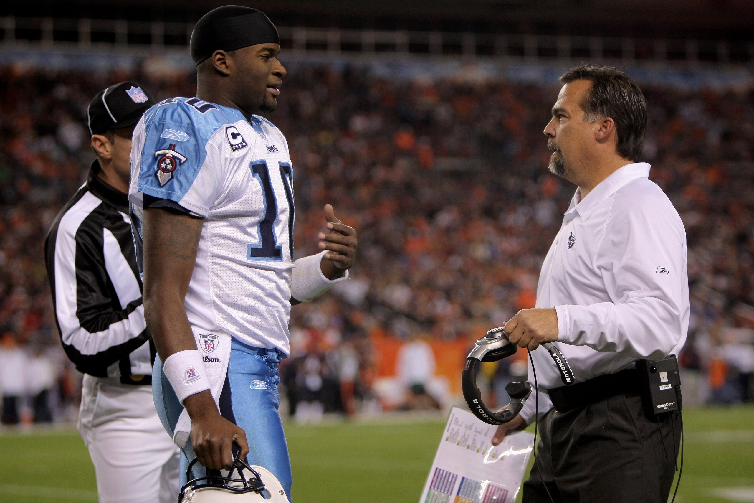 DENVER - NOVEMBER 19: Quarterback Vince Young #10 calls a time out and confers with head coach Jeff Fisher of the Tennessee Titans during the game against the Denver Broncos at Invesco Field at Mile High November 19, 2007 in Denver, Colorado. (Photo by DENVER - NOVEMBER 19: Quarterback Vince Young #10 calls a time out and confers with head coach Jeff Fisher of the Tennessee Titans during the game against the Denver Broncos at Invesco Field at Mile High November 19, 2007 in Denver, Colorado. (Photo by