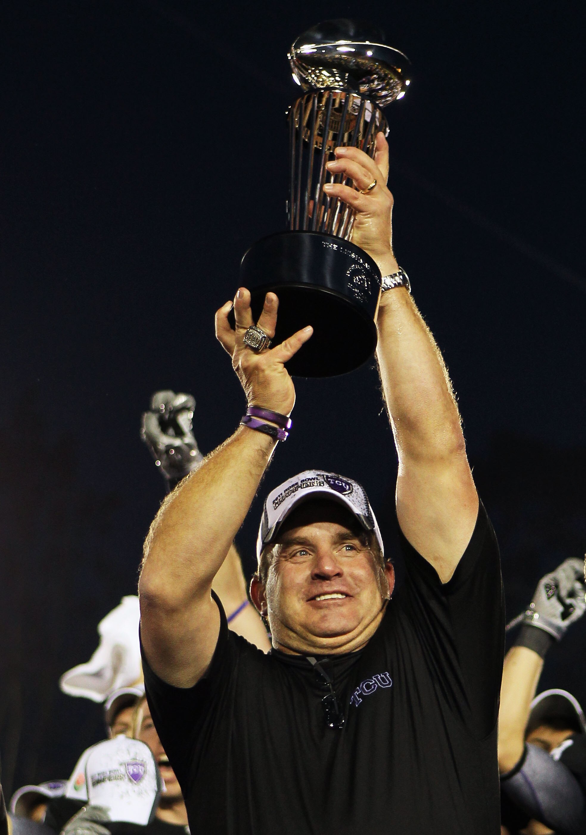 PASADENA, CA - JANUARY 01:  Head coach Gary Patterson of the TCU Horned Frogs holds the Rose Bowl Championship Trophy after defeating the Wisconsin Badgers 21-19 in the 97th Rose Bowl game on January 1, 2011 in Pasadena, California.  (Photo by Jeff Gross/