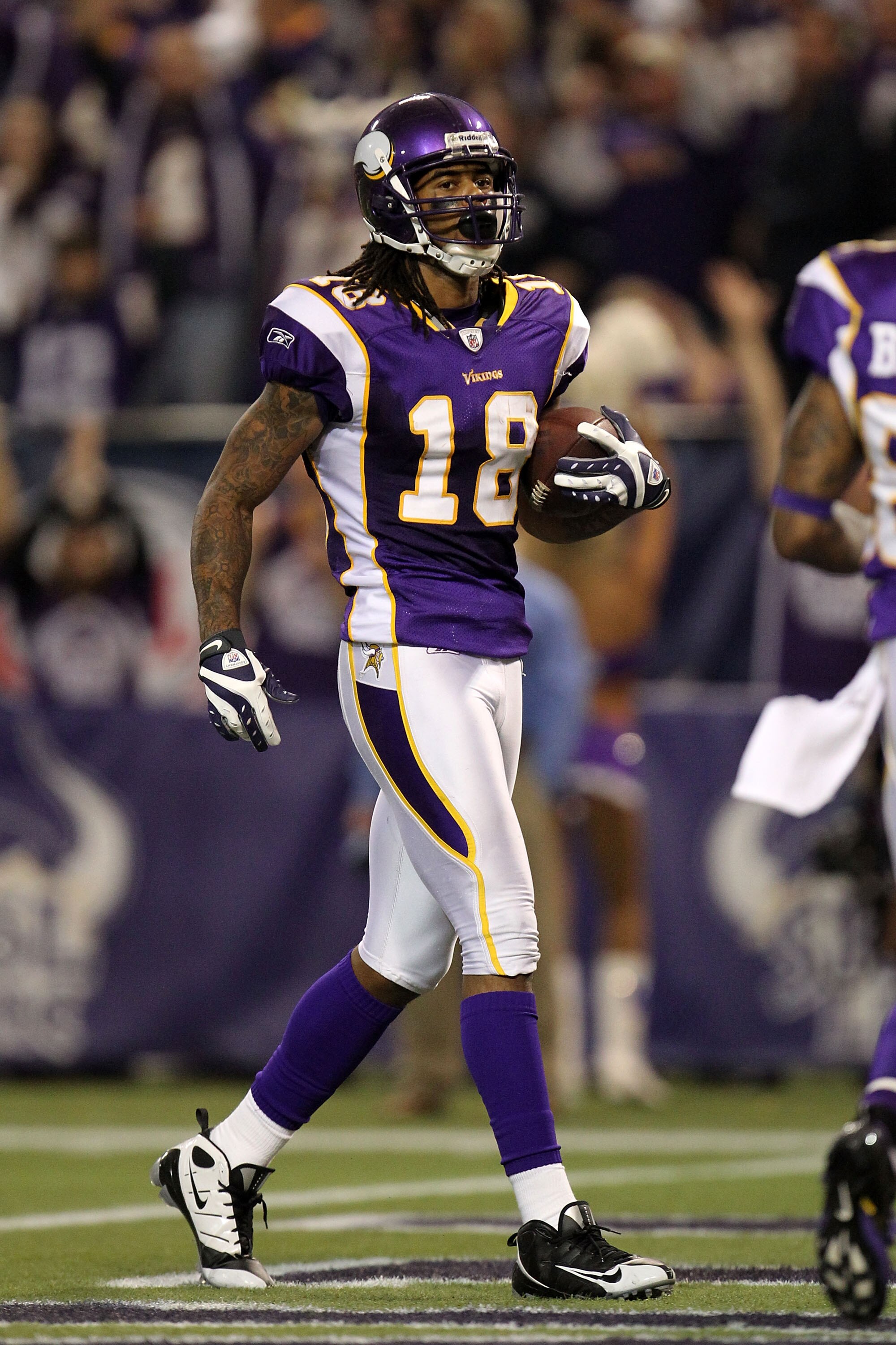 MINNEAPOLIS - JANUARY 17:  Sidney Rice #18 of the Minnesota Vikings scores a 45 yard touchdown against the Dallas Cowboys during the fourth quarter of the NFC Divisional Playoff Game at Hubert H. Humphrey Metrodome on January 17, 2010 in Minneapolis, Minn