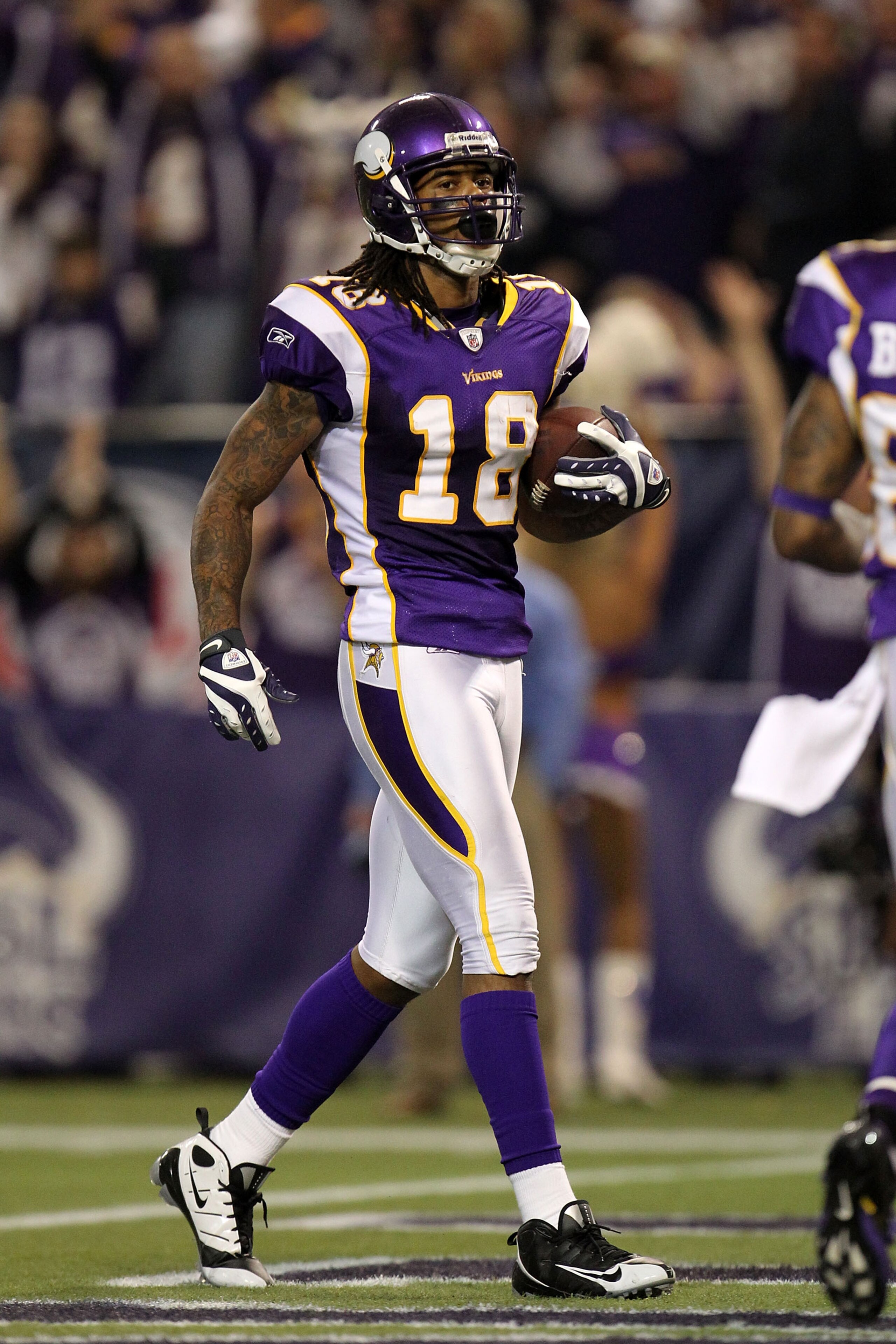 MINNEAPOLIS - JANUARY 17:  Sidney Rice #18 of the Minnesota Vikings scores a 45 yard touchdown against the Dallas Cowboys during the fourth quarter of the NFC Divisional Playoff Game at Hubert H. Humphrey Metrodome on January 17, 2010 in Minneapolis, Minn