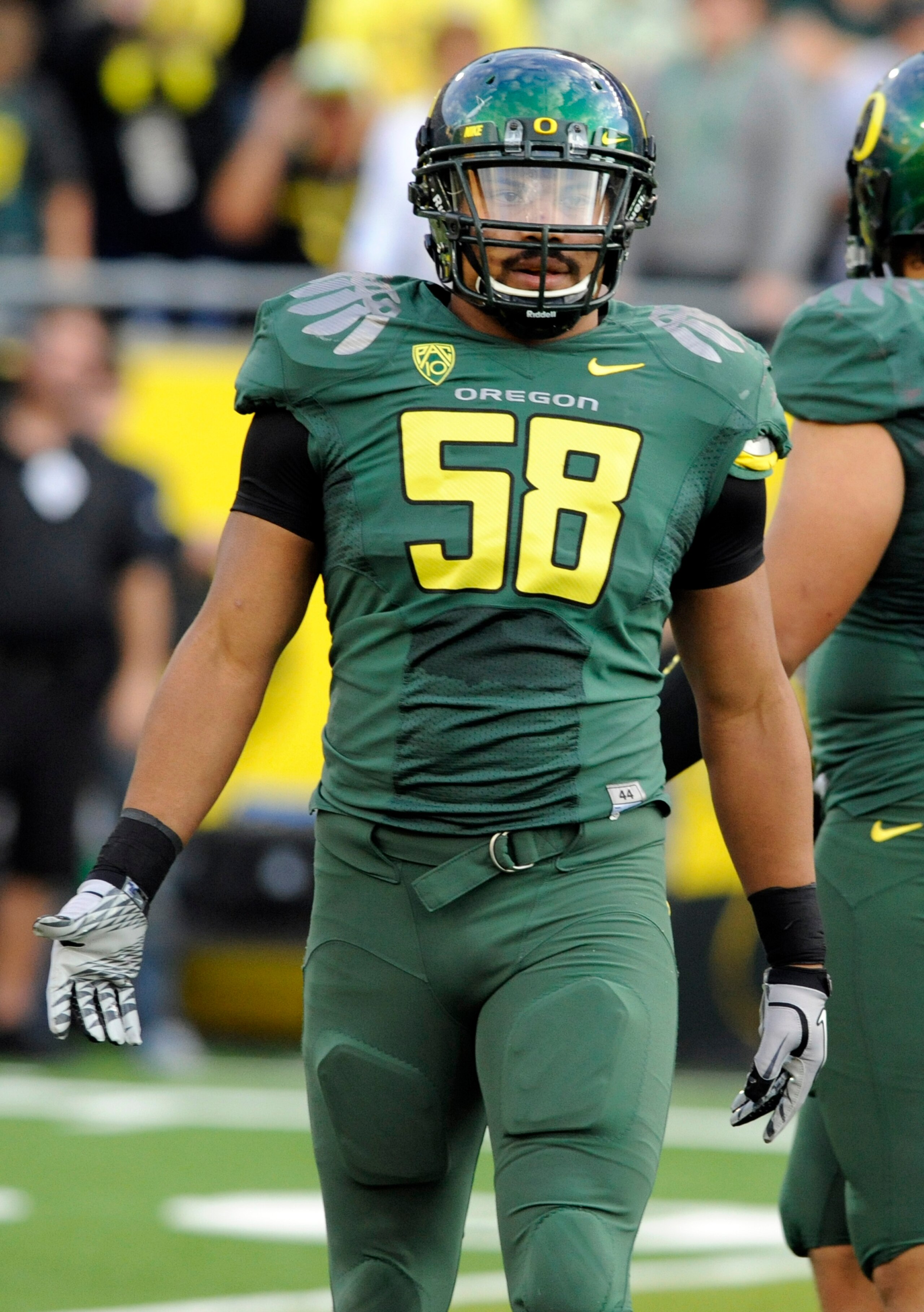 EUGENE, OR - OCTOBER 2: Defensive end Kenny Rowe #58 of the Oregon Ducks looks to the sidelines for a signal in the second quarter of the game against the Stanford Cardinal at Autzen Stadium on October 2, 2010 in Eugene, Oregon. Oregon won the game 52-31.