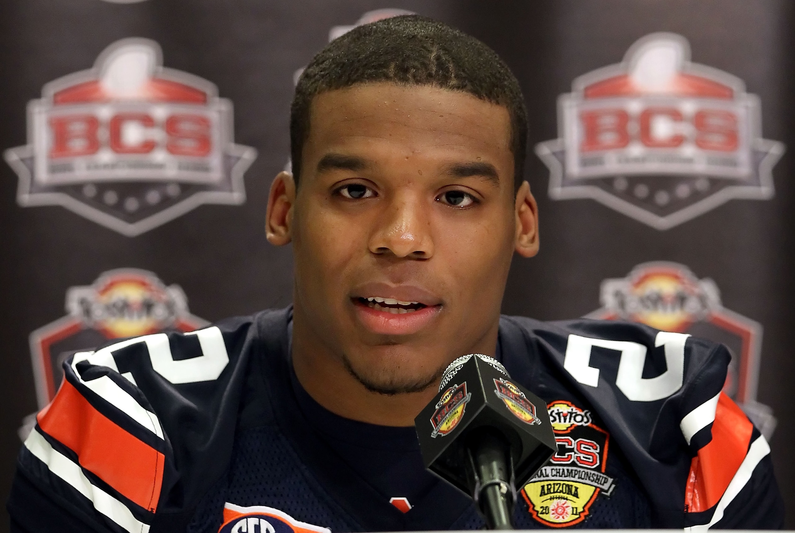 SCOTTSDALE, AZ - JANUARY 07: Quarterback Cam Newton #2 of the Auburn Tigers speaks during Media Day for the Tostitos BCS National Championship Game at the JW Marriott Camelback Inn on January 7, 2011 in Scottsdale, Arizona. (Photo by Christian Petersen/ SCOTTSDALE, AZ - JANUARY 07: Quarterback Cam Newton #2 of the Auburn Tigers speaks during Media Day for the Tostitos BCS National Championship Game at the JW Marriott Camelback Inn on January 7, 2011 in Scottsdale, Arizona. (Photo by Christian Petersen/