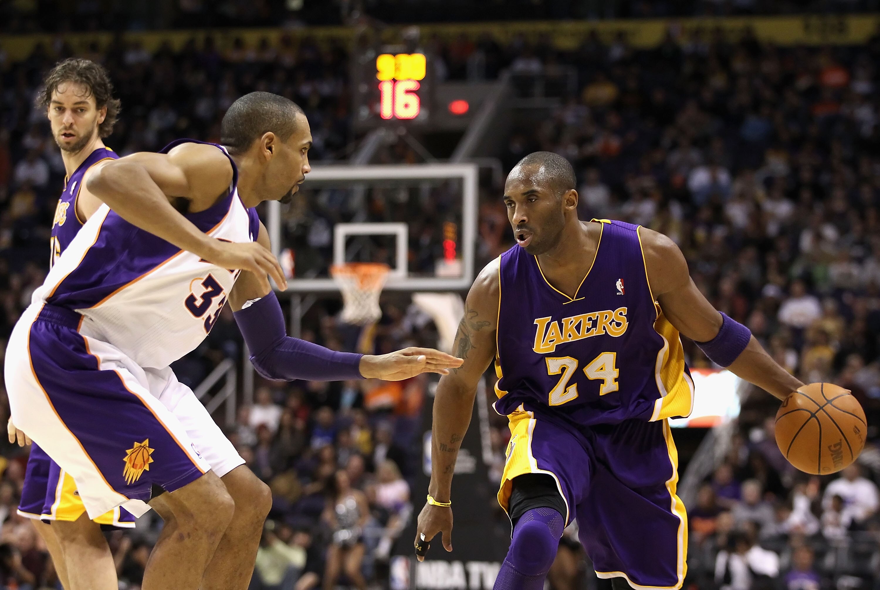 PHOENIX - JANUARY 05: Kobe Bryant #24 of the Los Angeles Lakers moves the ball upcourt against Grant Hill #33 of the Phoenix Suns during the NBA game at US Airways Center on January 5, 2011 in Phoenix, Arizona. The Lakers defeated the Suns 99-95. NOTE TO
