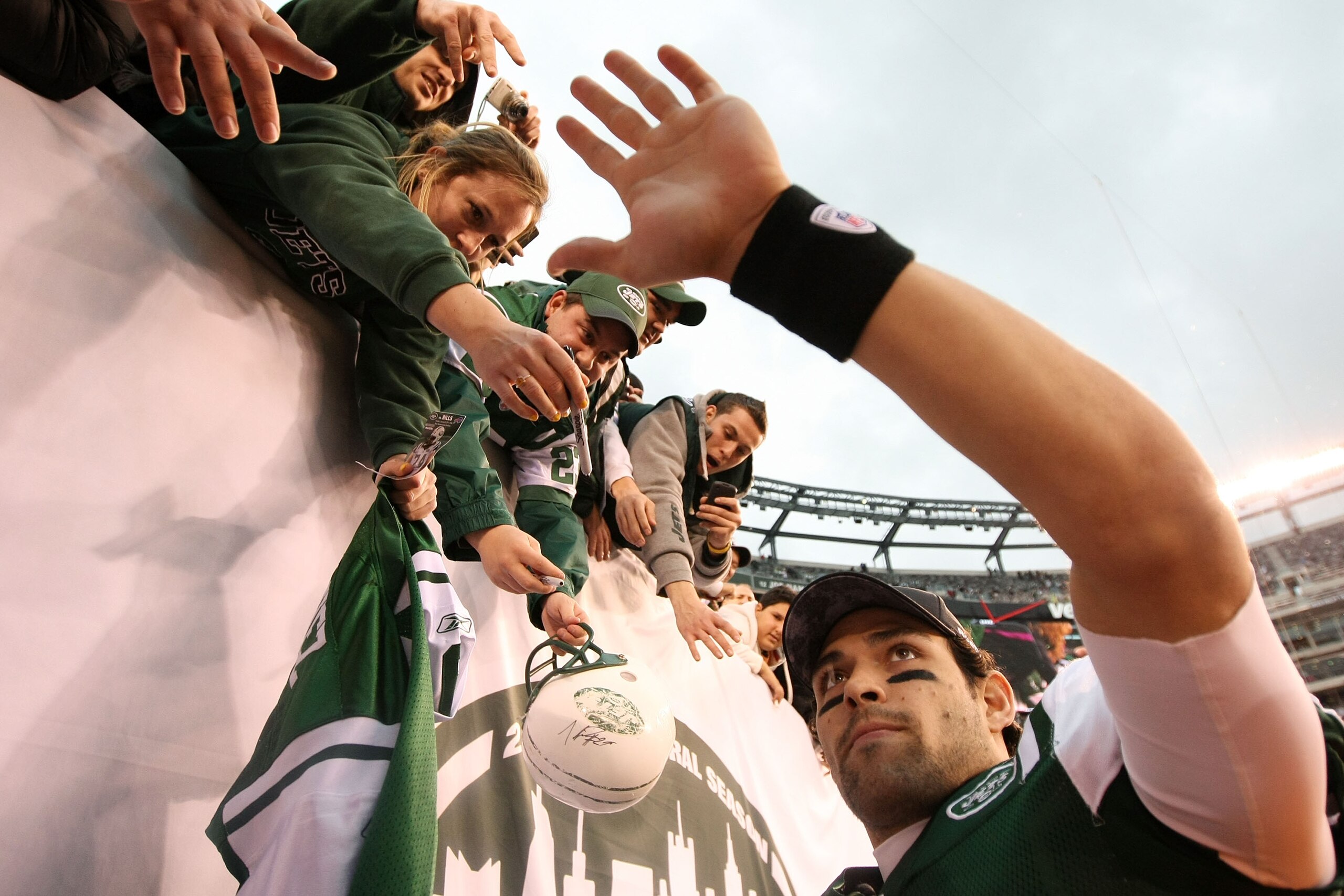 EAST RUTHERFORD, NJ - JANUARY 02: Quarterback Mark Sanchez #6 of the New York Jets celebrates with fans after they defeated the Buffalo Bills 38 to 7 at New Meadowlands Stadium on January 2, 2011 in East Rutherford, New Jersey. (Photo by Al Bello/Getty EAST RUTHERFORD, NJ - JANUARY 02: Quarterback Mark Sanchez #6 of the New York Jets celebrates with fans after they defeated the Buffalo Bills 38 to 7 at New Meadowlands Stadium on January 2, 2011 in East Rutherford, New Jersey. (Photo by Al Bello/Getty