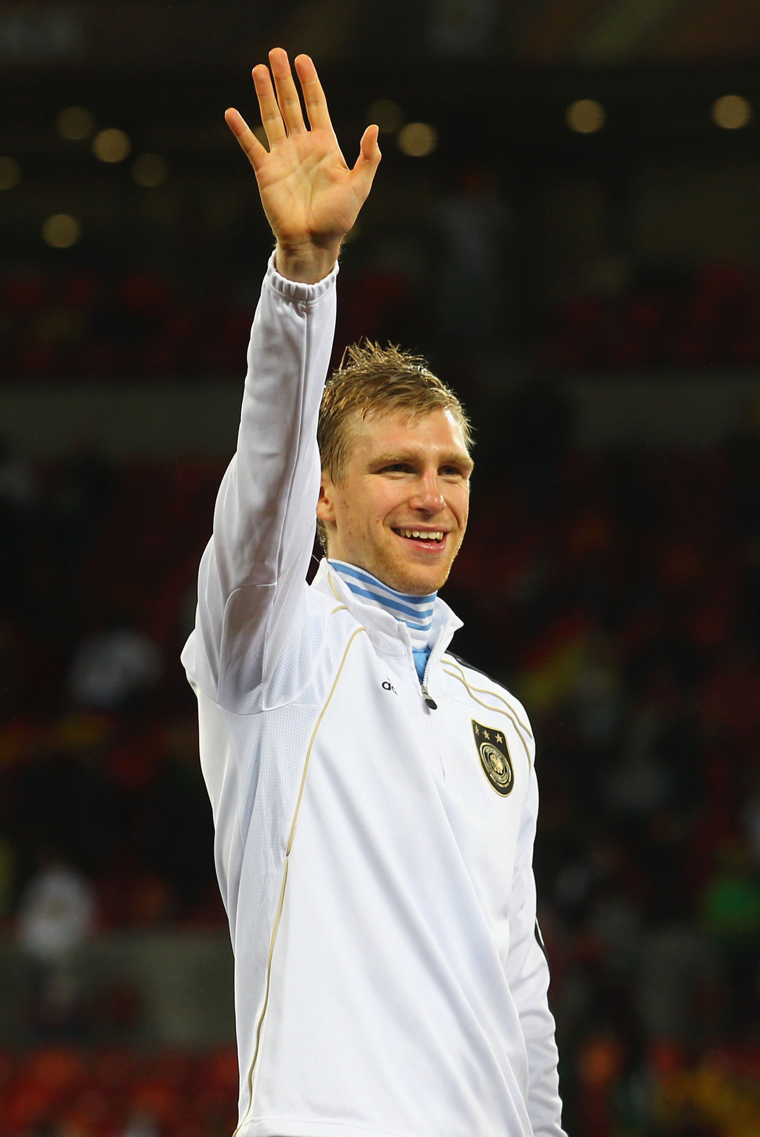 PORT ELIZABETH, SOUTH AFRICA - JULY 10: Per Mertesacker of Germany celebrates victory and third place following the 2010 FIFA World Cup South Africa Third Place Play-off match between Uruguay and Germany at The Nelson Mandela Bay Stadium on July 10, 2010 PORT ELIZABETH, SOUTH AFRICA - JULY 10: Per Mertesacker of Germany celebrates victory and third place following the 2010 FIFA World Cup South Africa Third Place Play-off match between Uruguay and Germany at The Nelson Mandela Bay Stadium on July 10, 2010