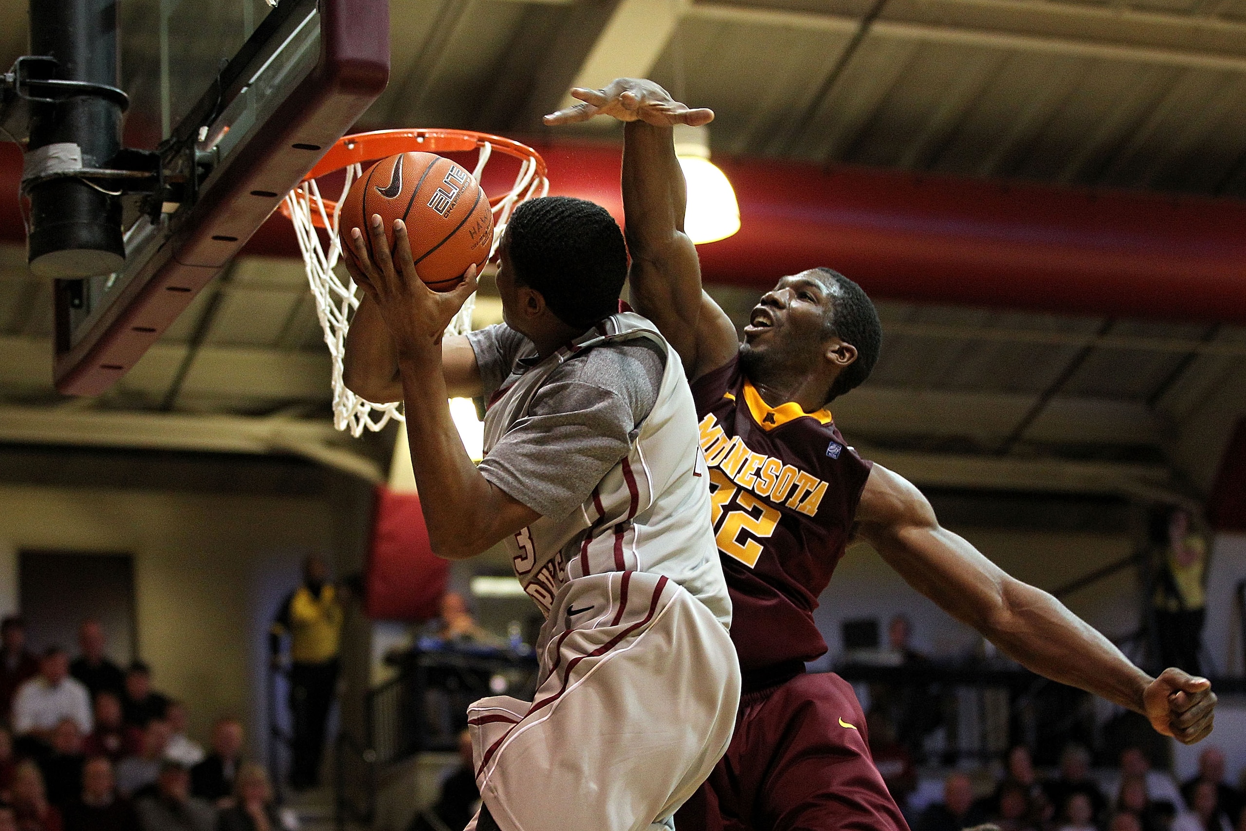 PHILADELPHIA, PA - DECEMBER 08:  Trevor Mbakwe #32 of the Minnesota Golden Gophers defends against Ronald Roberts Jr. #13 of the St. Joseph's Hawks at Michael J. Hagan Arena on December 8, 2010 in Philadelphia, Pennsylvania.  (Photo by Chris Chambers/Gett