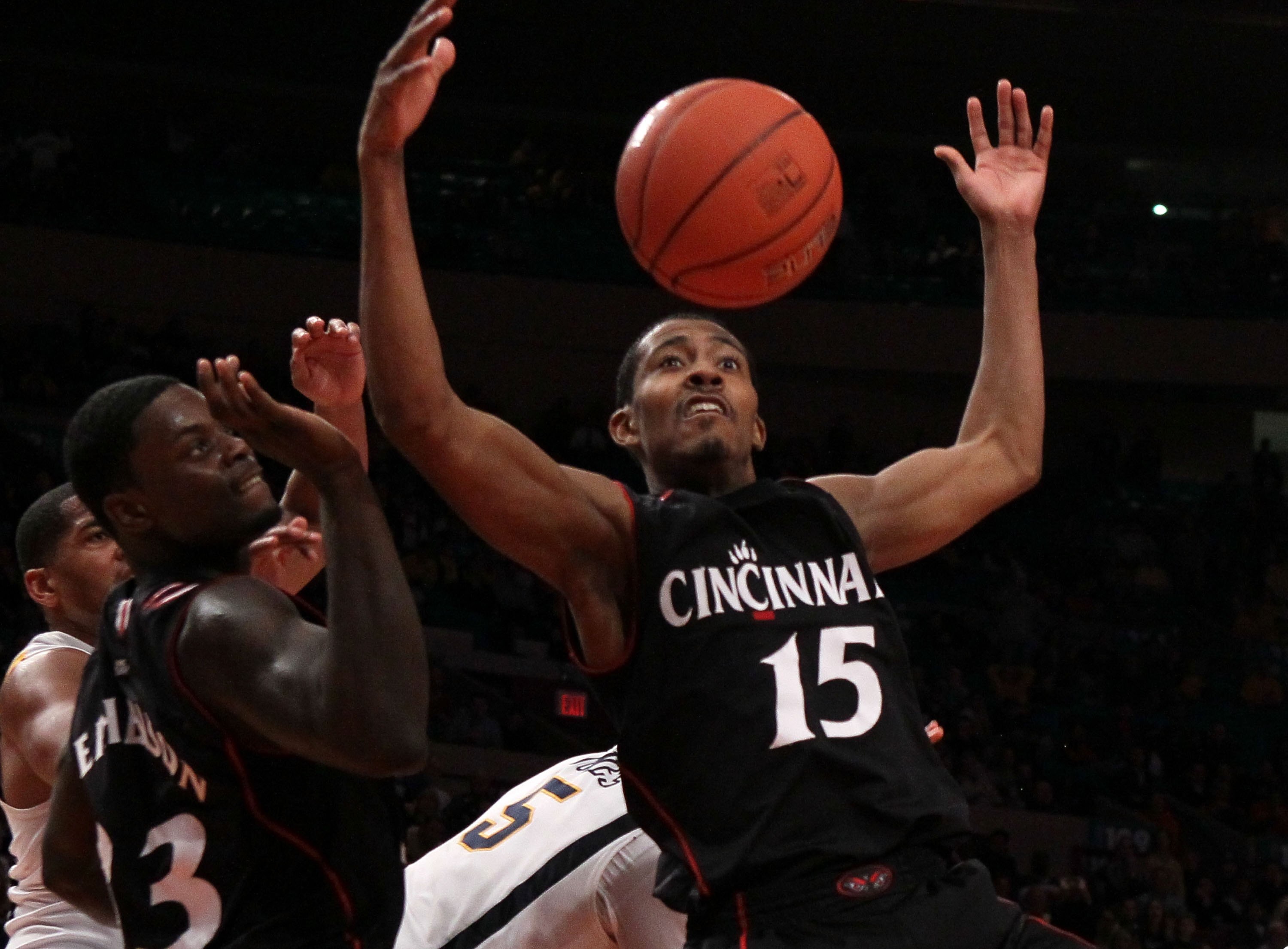 NEW YORK - MARCH 11: Darnell Wilks #15 of the Cincinnati Bearcats goes for a loose ball against the West Virginia Mountaineers during the quarterfinal of the 2010 NCAA Big East Tournament at Madison Square Garden on March 11, 2010 in New York City.  (Phot