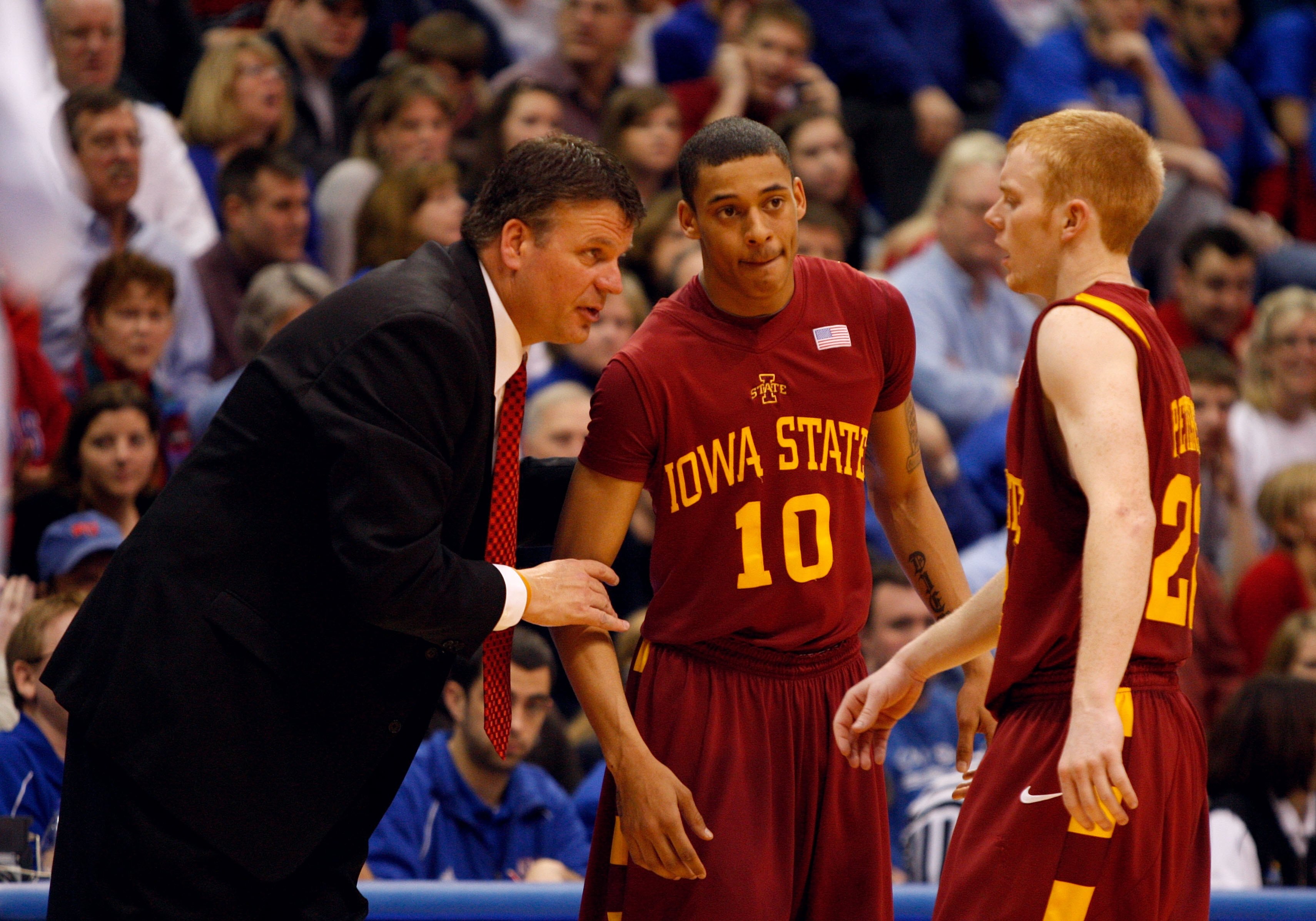 LAWRENCE, KS - FEBRUARY 18:  Head Coach Greg McDermott of the Iowa State Cyclones speaks to Bryan Petersen #22 as teammate Diante Garrett #10 of the Iowa State Cyclones looks on during the game against the Kansas Jayhawks on February 18, 2009 at Phog Alle