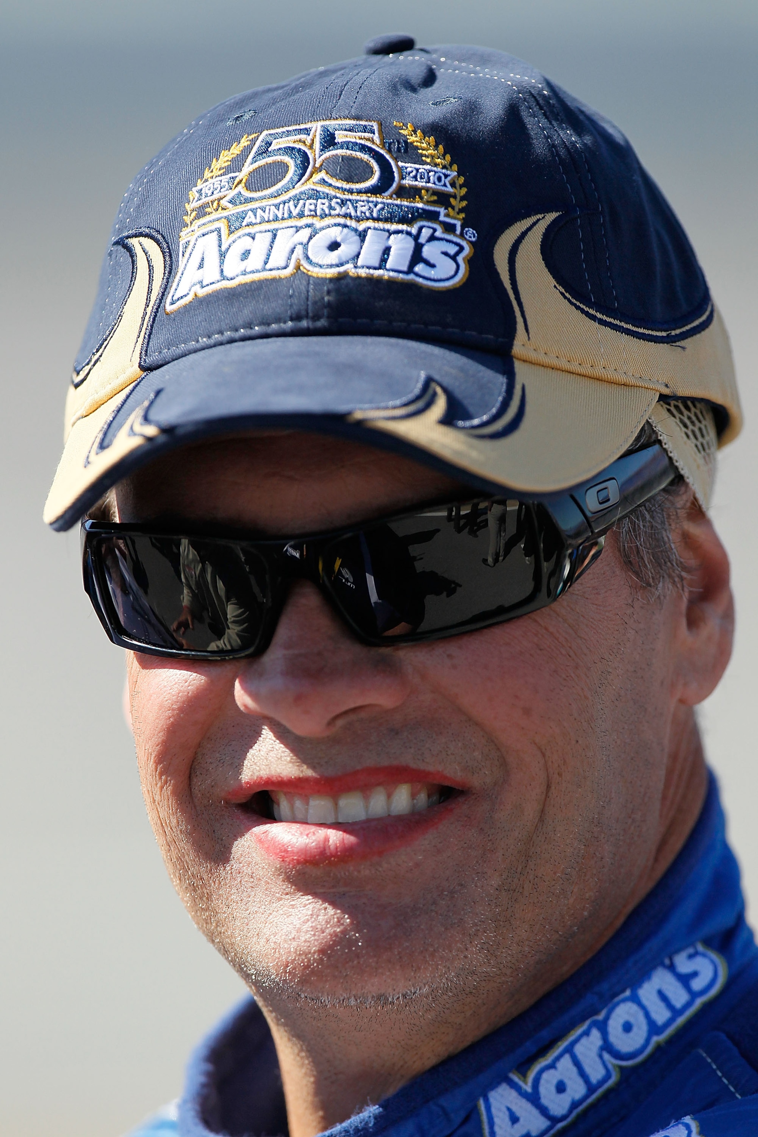 TALLADEGA, AL - OCTOBER 30:  Michael Waltrip, driver of the #55 Aaron's 55th Anniversary Toyota,  stands on pit road during qualifying for the NASCAR Sprint Cup Series AMP Energy Juice 500 at Talladega Superspeedway on October 30, 2010 in Talladega, Alaba