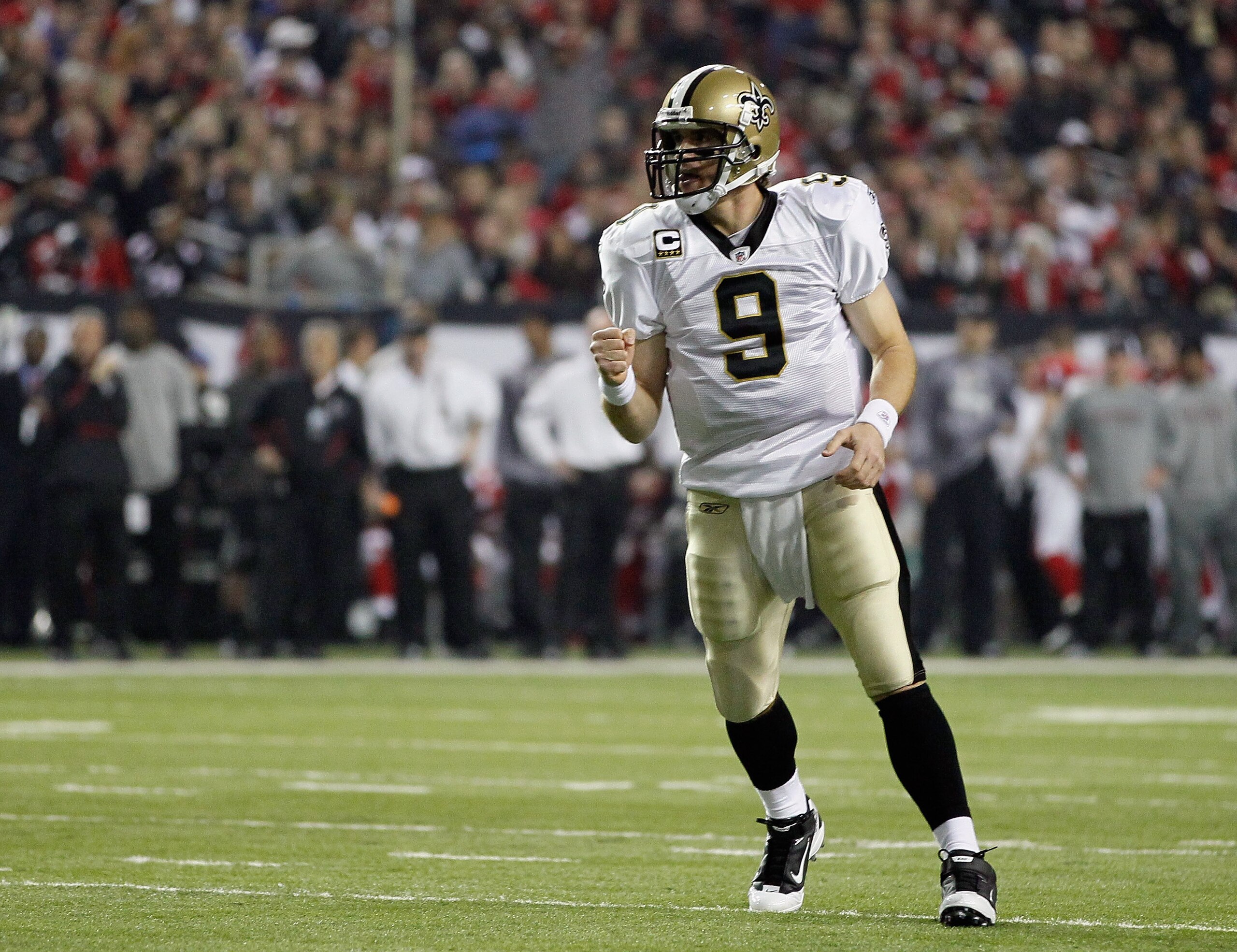 ATLANTA, GA - DECEMBER 27:  Quarterback Drew Brees #9 of the New Orleans Saints celebrates a touchdown pass in the first half during the game against the Atlanta Falcons at the Georgia Dome on December 27, 2010 in Atlanta, Georgia.  (Photo by Kevin C. Cox