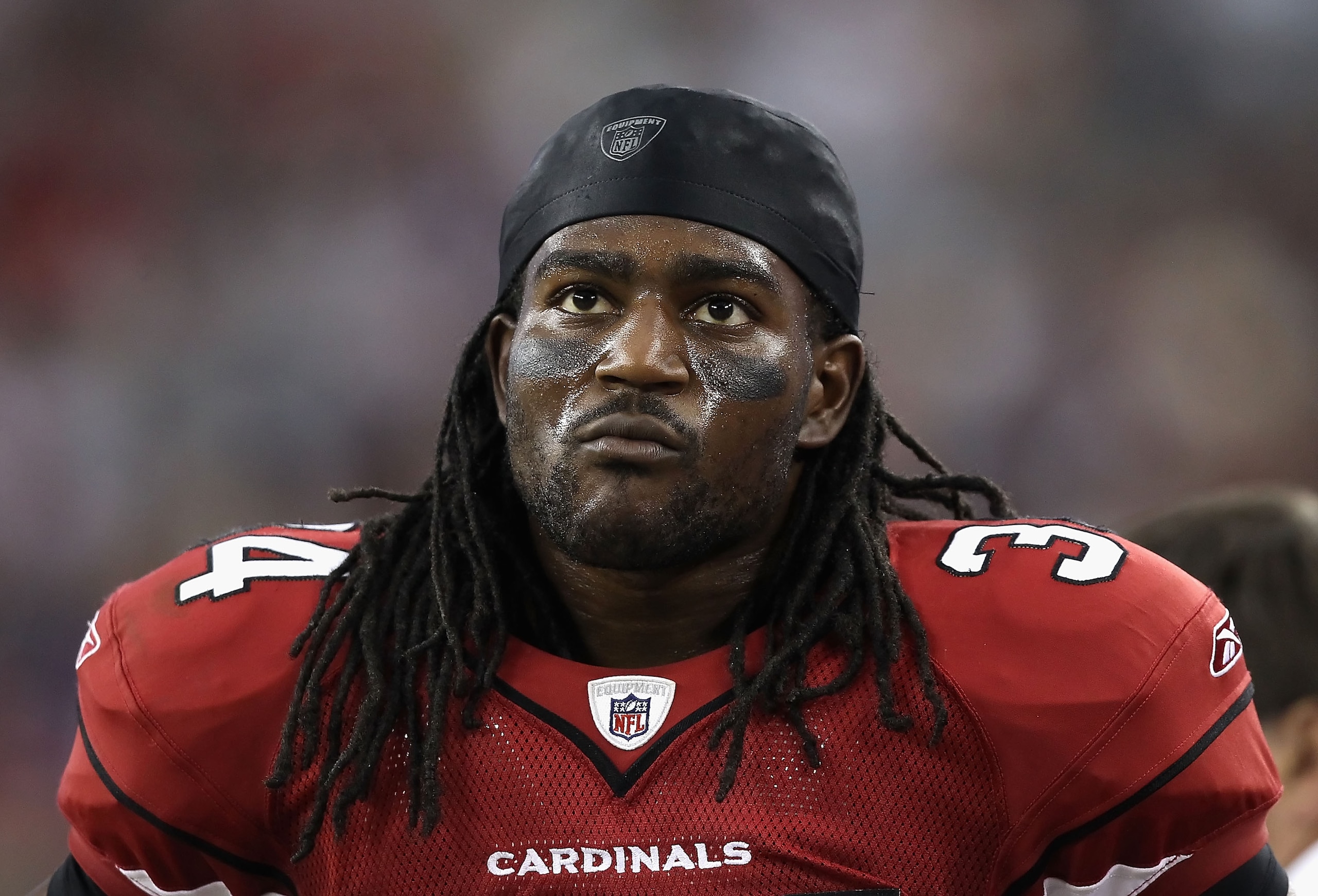 GLENDALE, AZ - DECEMBER 12:  Runningback Tim Hightower #34 of the Arizona Cardinals stands on the sidelines during the NFL game against the Denver Broncos at the University of Phoenix Stadium on December 12, 2010 in Glendale, Arizona.  The Cardinals defea
