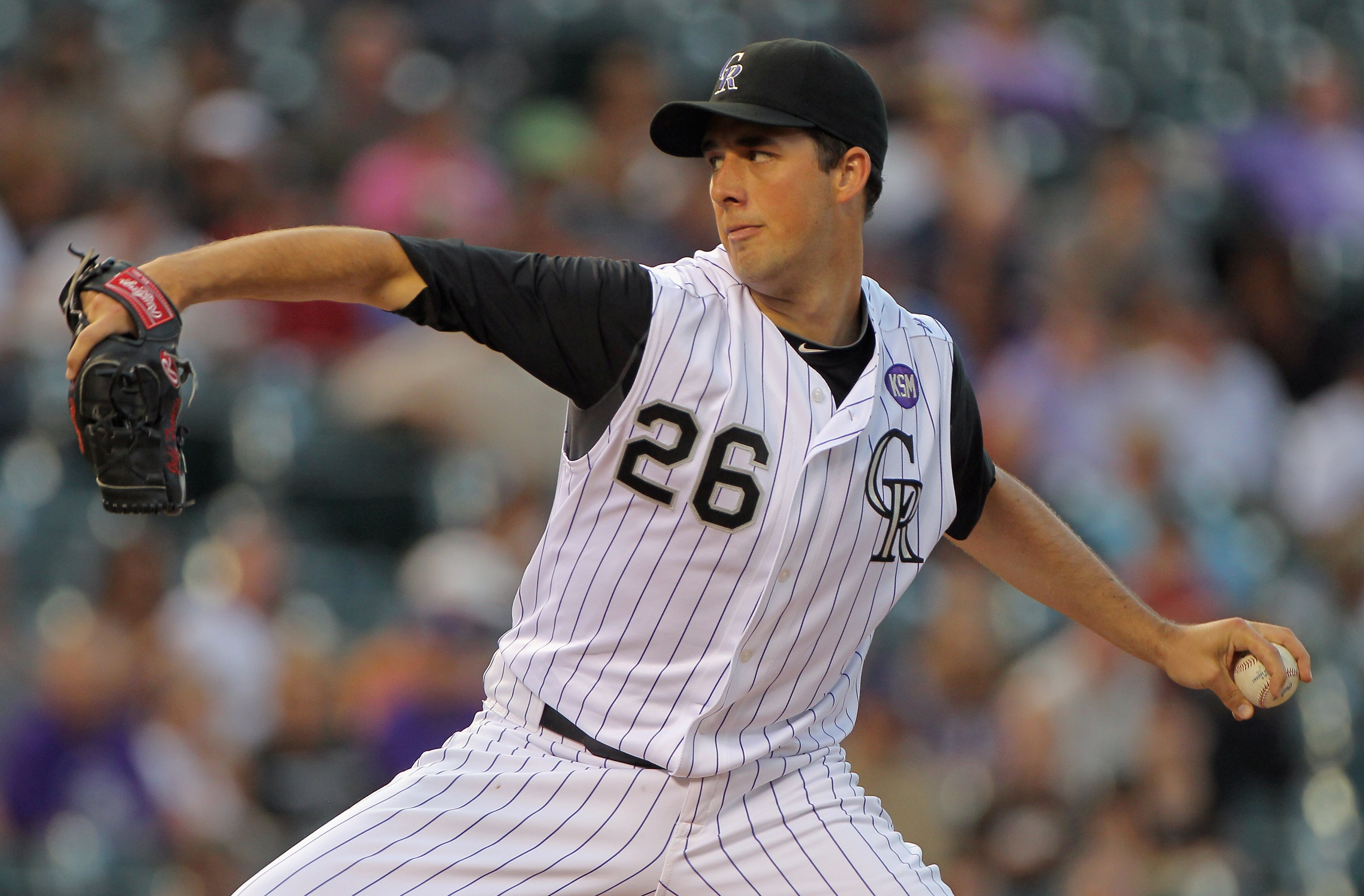 DENVER - SEPTEMBER 13:  Starting pitcher Jeff Francis #26 of the Colorado Rockies delivers against the San Diego Padres at Coors Field on September 13, 2010 in Denver, Colorado.  (Photo by Doug Pensinger/Getty Images)