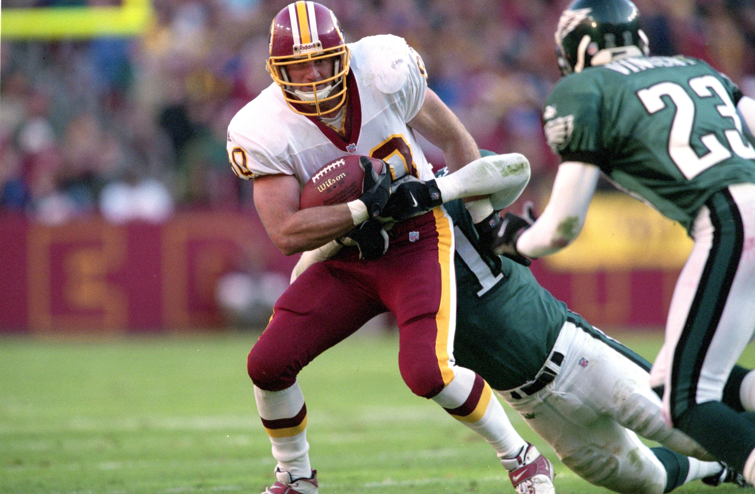 26 Nov 2000:  Stephen Alexander #80 of the Washington Redskins tries to run against Al Harris #31 of the Philadelphia Eagles during the game at the FedEx Field in Landover, Maryland. The Eagles defeated the Redskins 23-20.Mandatory Credit: Jamie Squire  /