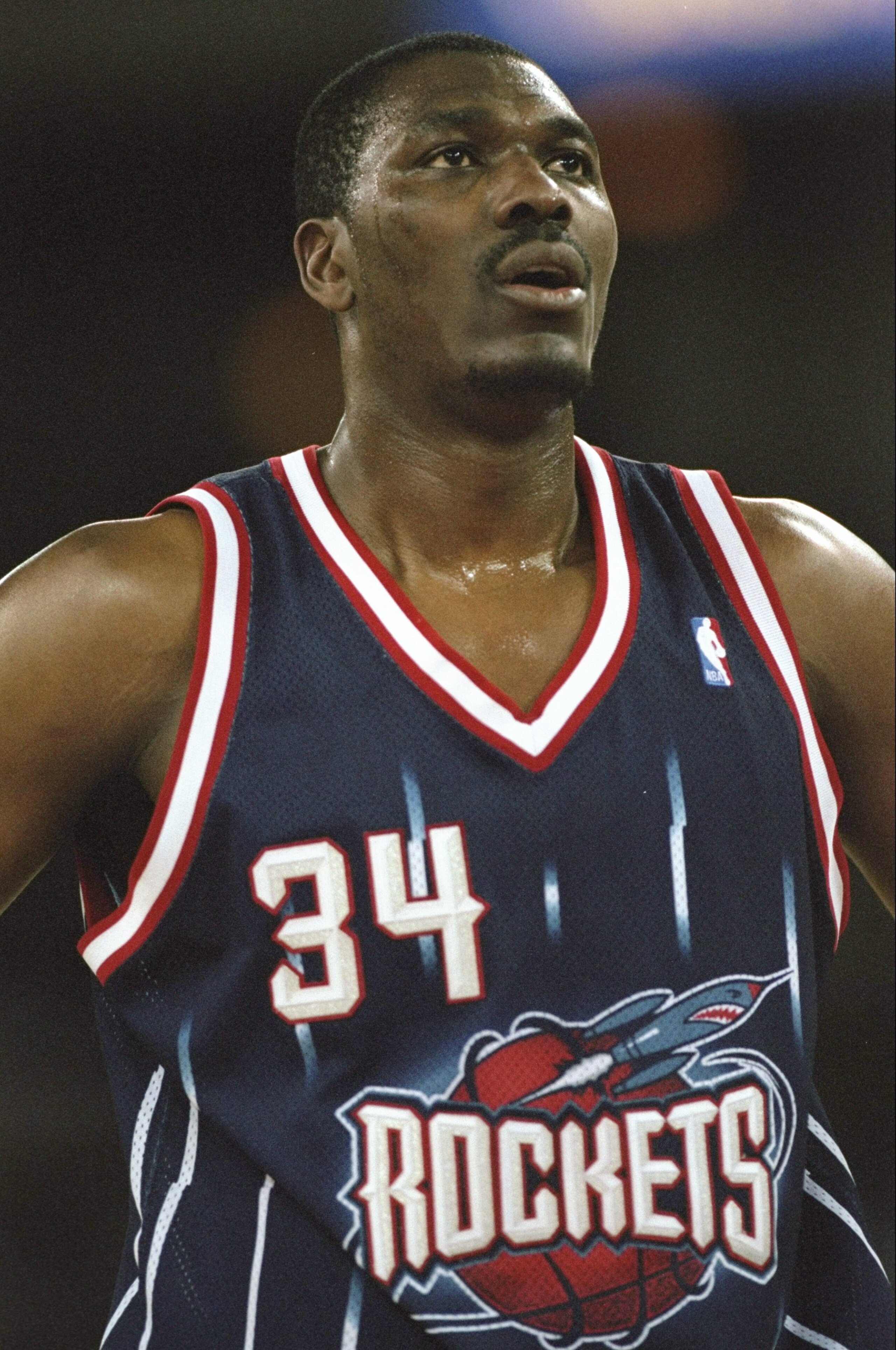 17 Mar 1999:  Hakeem Olajuwon #34 of the Houston Rockets looking on during the game against the Denver Nuggets at the McNichols Arena in Denver, Colorado. The Rockets defeated the Nuggets 114-103.   Mandatory Credit: Brian Bahr  /Allsport