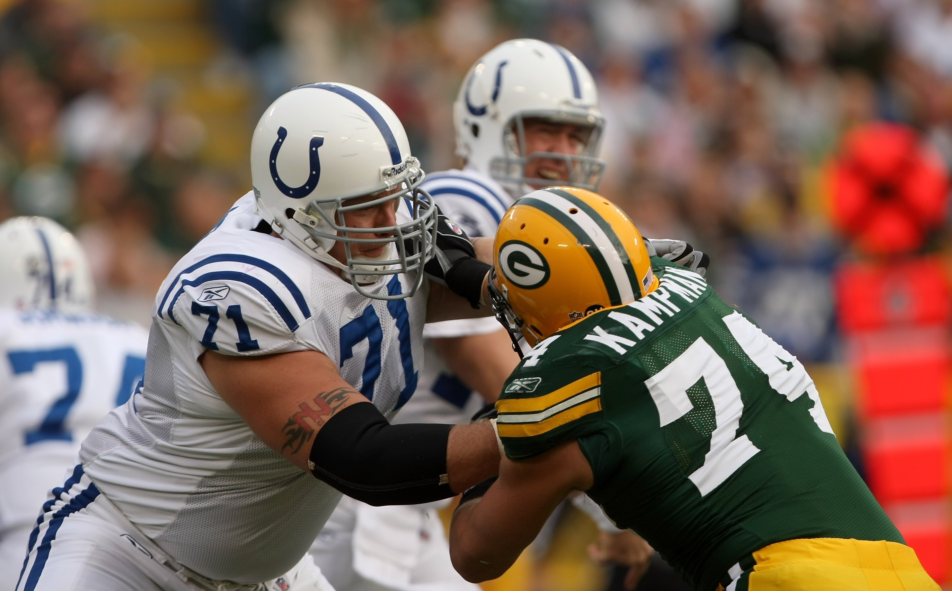 GREEN BAY, WI - OCTOBER 19:  Tackle Ryan Diem #71 of the Indianapolis Colts blocks against Aaron kampman #74 of the Green Bay Packers on October 19, 2008 at Lambeau Field in Green Bay Wisconsin. The Packers won 34-14.   (Photo by Stephen Dunn/Getty Images