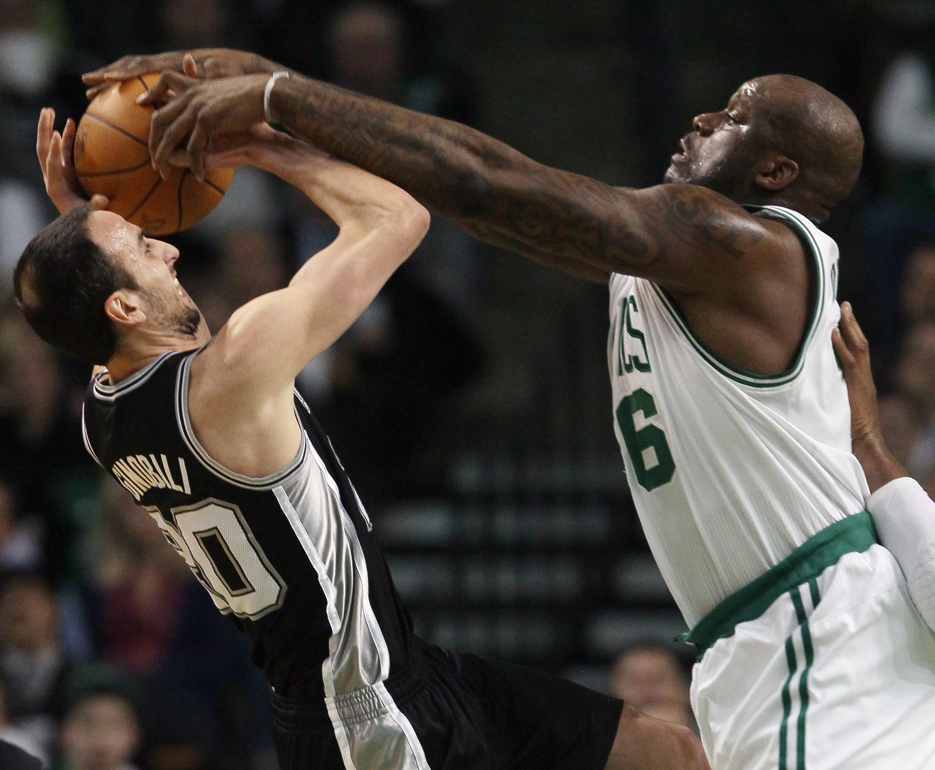 BOSTON, MA - JANUARY 05:  Manu Ginobili #20 of the San Antonio Spurs tries to take a shot as Shaquille O'Neal #36 of the Boston Celtics attempts to block on January 5, 2011 at the TD Garden in Boston, Massachusetts. NOTE TO USER: User expressly acknowledg