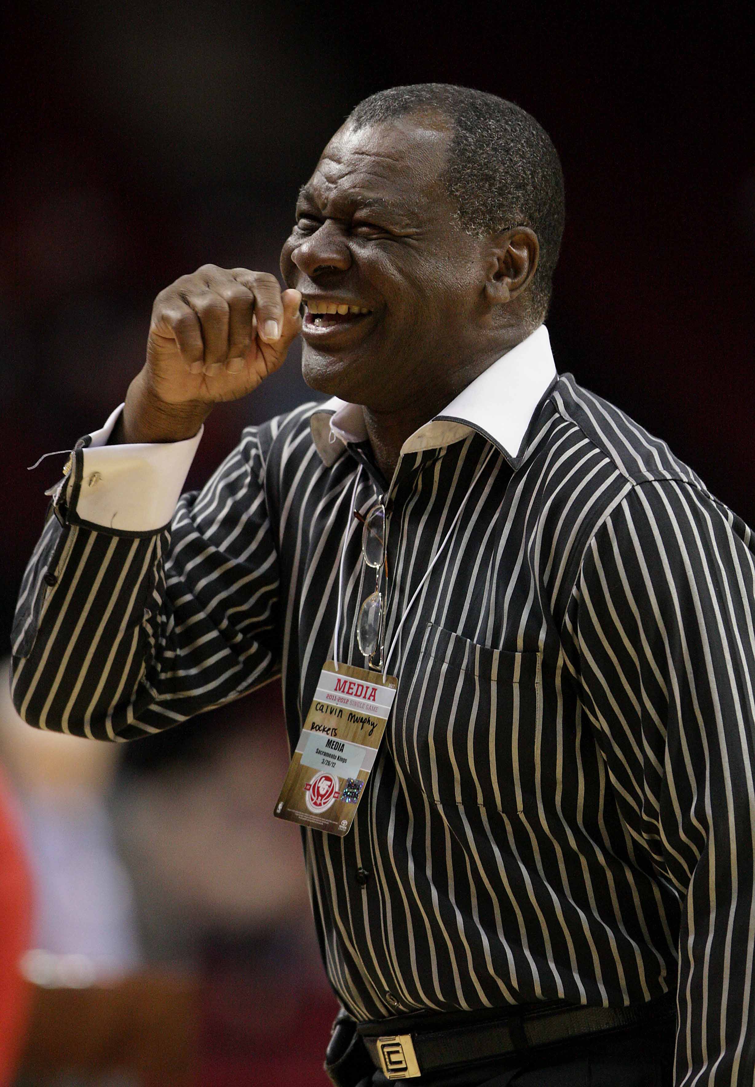 March 26, 2012; Houston, TX, USA; Houston Rocket former player Calvin Murphy laughs before a game against the Sacramento Kings at Toyota Center. Mandatory Credit: Troy Taormina-USA TODAY Sports
