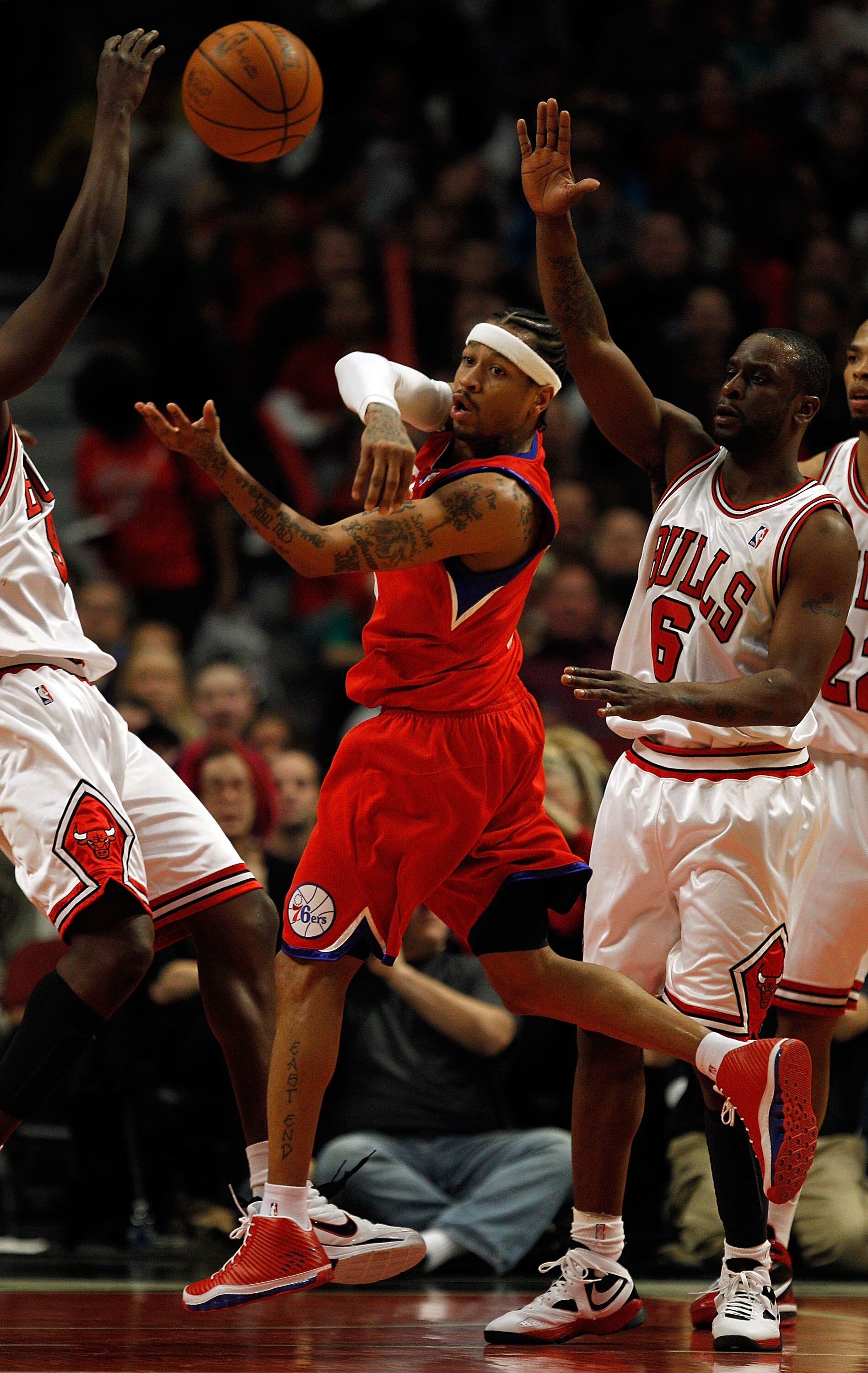 CHICAGO - FEBRUARY 20: Allen Iverson #3 of the Philadelphia 76ers passes the ball under pressure from Ronald Murray #6 of the Chicago Bulls at the United Center on February 20, 2010 in Chicago, Illinois. The Bulls defeated the 76ers 122-90. NOTE TO USER: