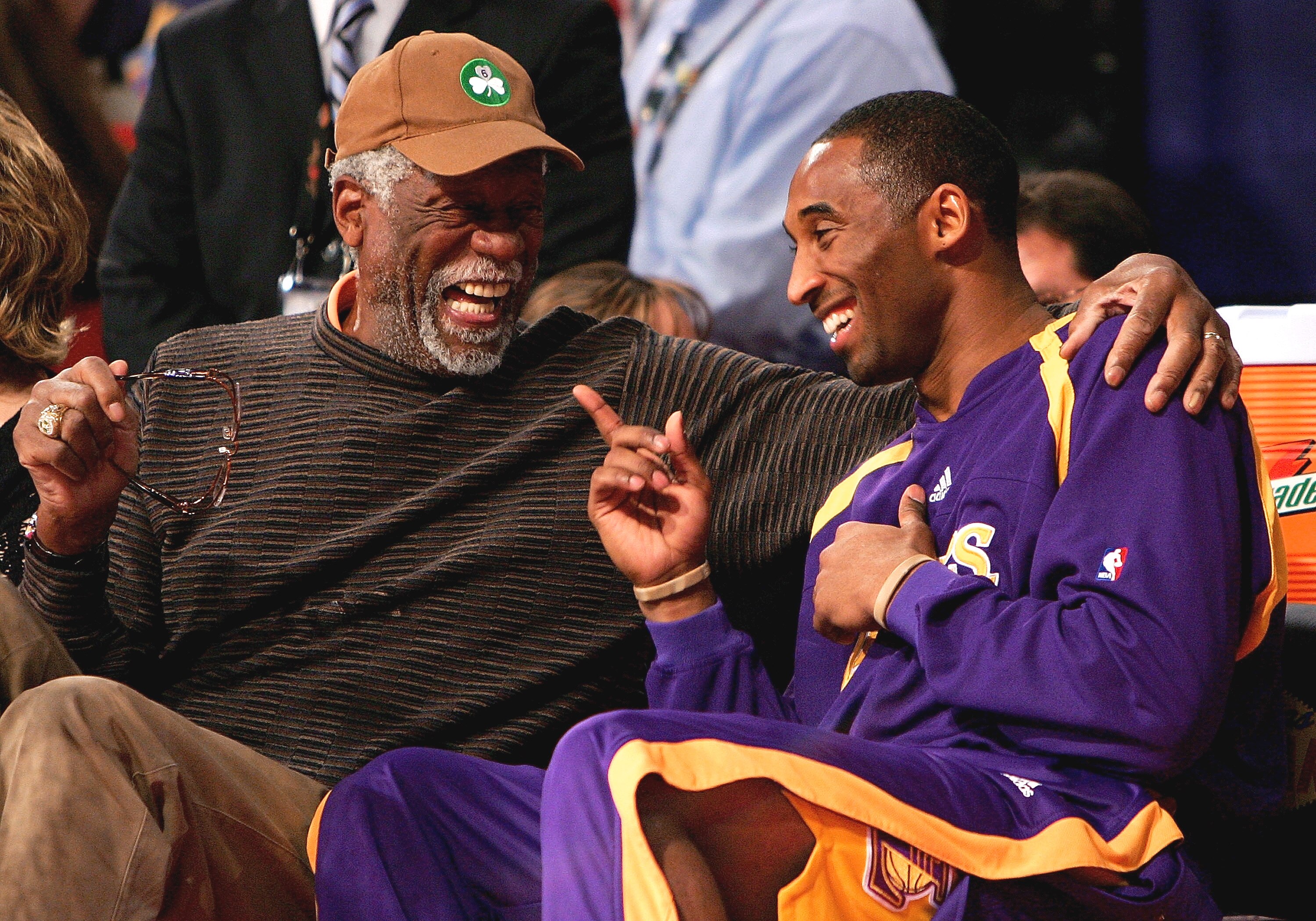 LAS VEGAS - FEBRUARY 17:  NBA legend Bill Russell and Kobe Bryant of the Los Angeles Lakers laugh on the sidelines during the Haier Shooting Stars Competition during NBA All-Star Weekend on February 17, 2007 at Thomas & Mack Center in Las Vegas, Nevada.