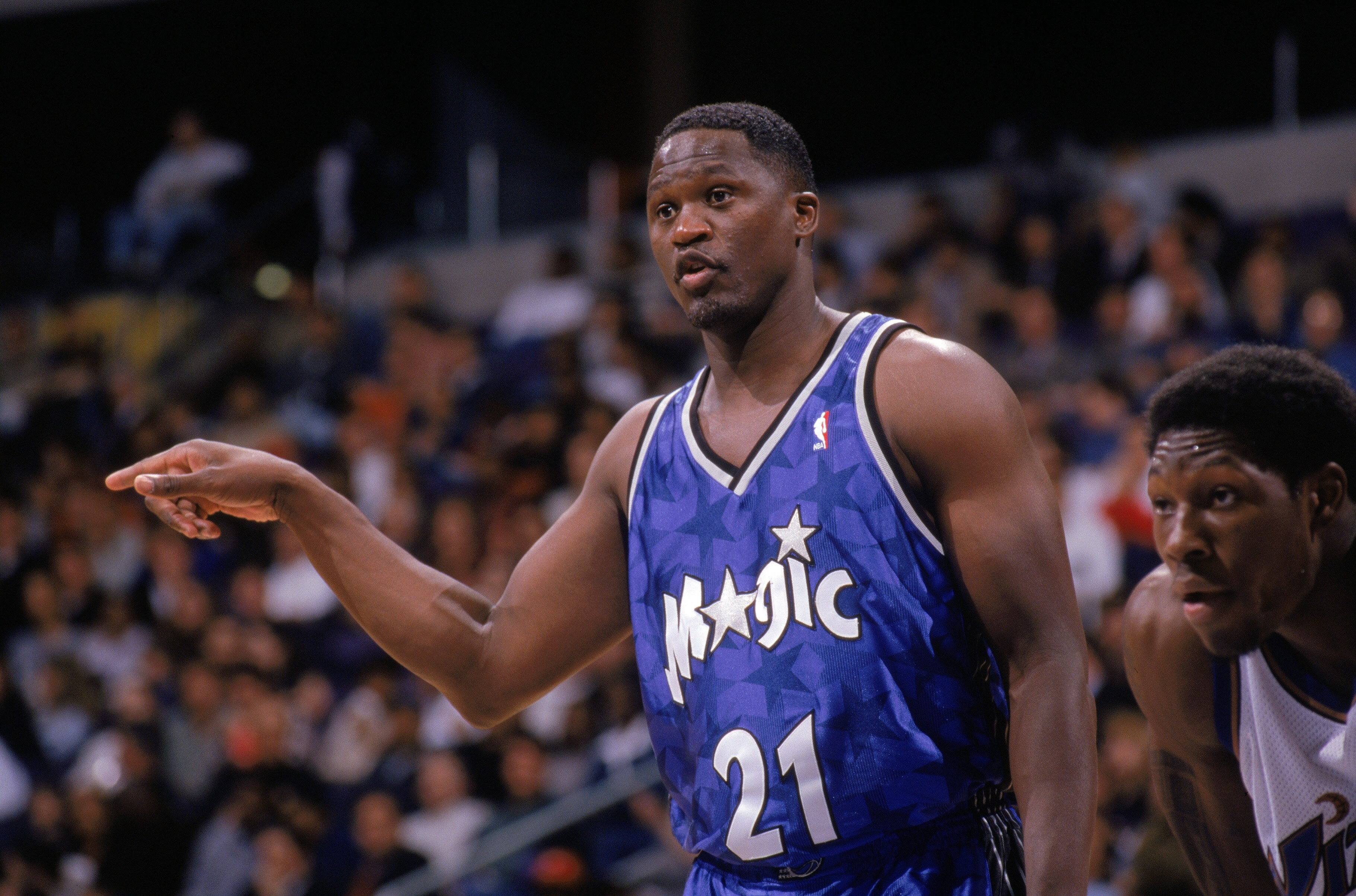 WASHINGTON - MARCH 31:  Dominique Wilkins #21 of the Orlando Magic points during the game against the Washington Wizards at MCI Center on March 31, 1999 in Washington, D.C.  The Wizards won 84-73.  (Photo by Doug Pensinger/Getty Images)