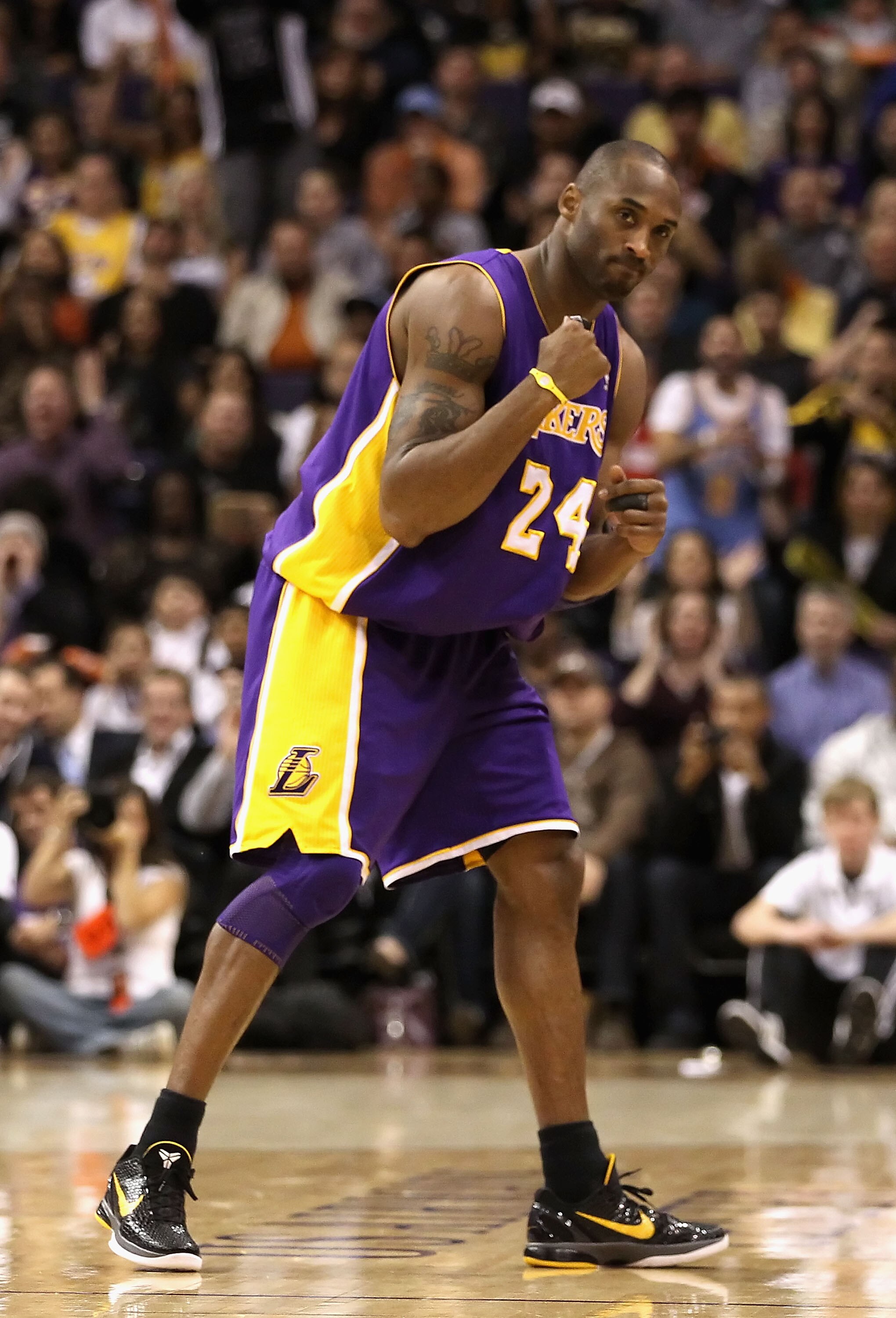 PHOENIX - JANUARY 05: Kobe Bryant #24 of the Los Angeles Lakers pumps his fist after a fould was called against the Phoenix Suns during the NBA game at US Airways Center on January 5, 2011 in Phoenix, Arizona. NOTE TO USER: User expressly acknowledges and