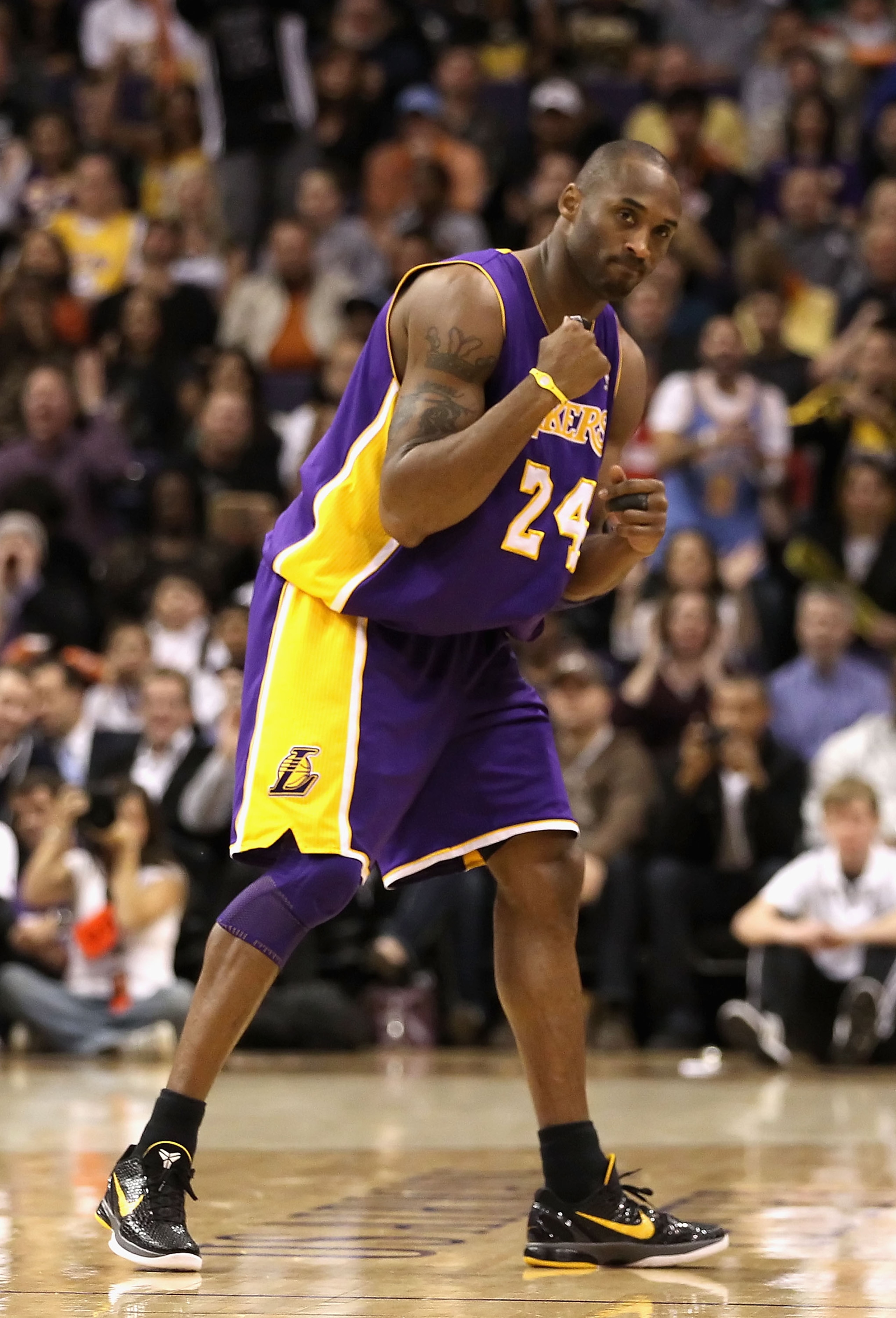PHOENIX - JANUARY 05: Kobe Bryant #24 of the Los Angeles Lakers pumps his fist after a fould was called against the Phoenix Suns during the NBA game at US Airways Center on January 5, 2011 in Phoenix, Arizona. NOTE TO USER: User expressly acknowledges and