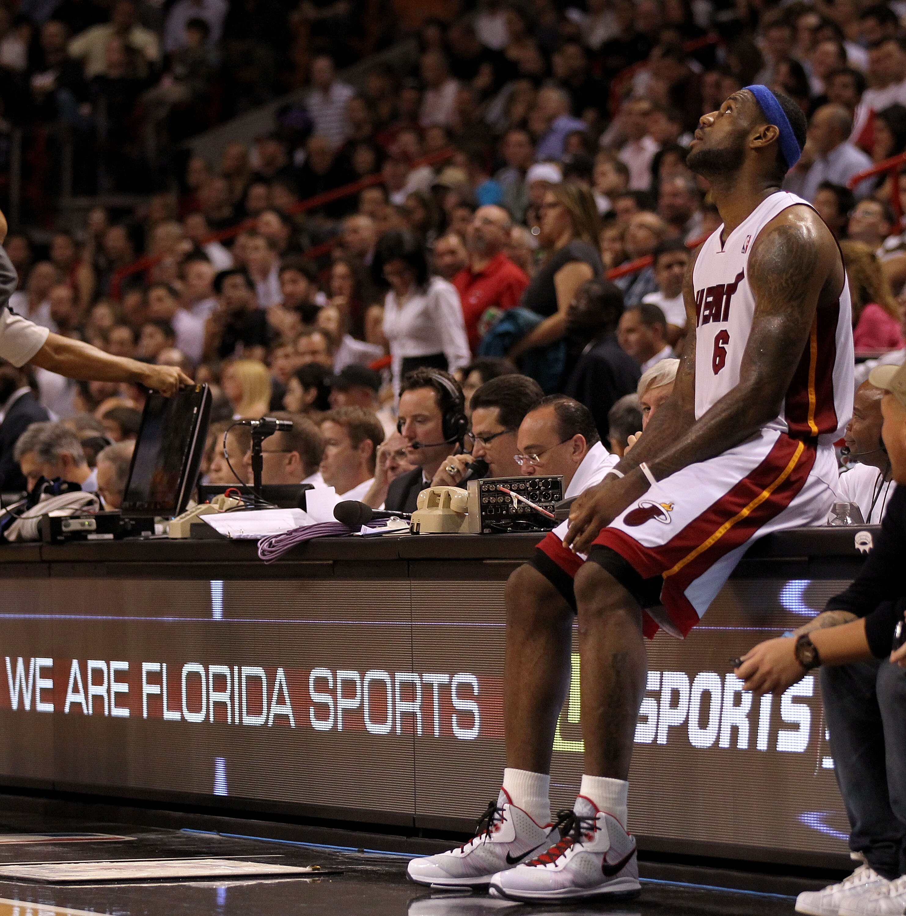 MIAMI, FL - JANUARY 04:  LeBron James #6 of the Miami Heat waits on the scorers table during a game against the Milwaukee Bucks at American Airlines Arena on January 4, 2011 in Miami, Florida. NOTE TO USER: User expressly acknowledges and agrees that, by