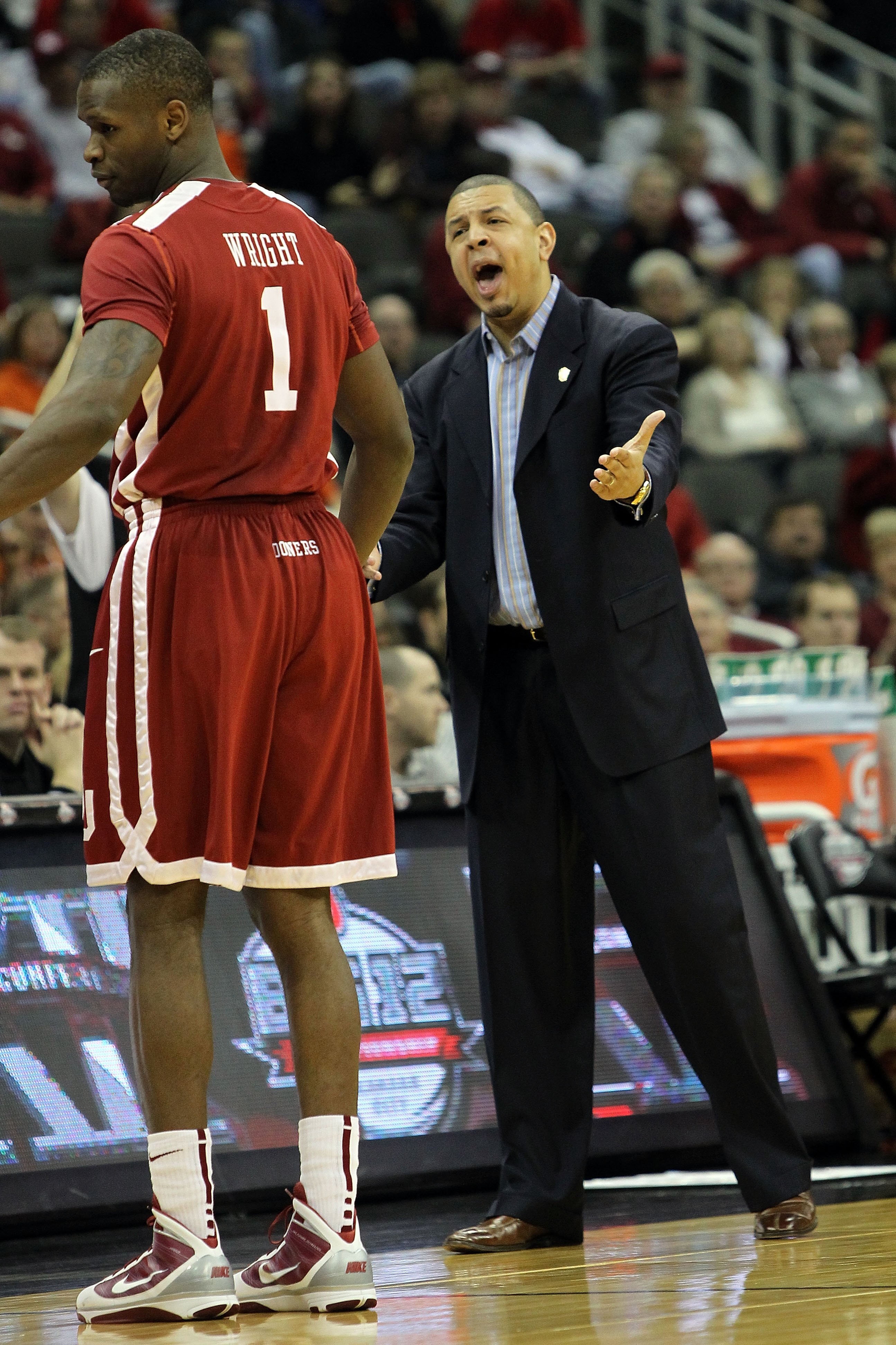 KANSAS CITY, MO - MARCH 10:  Head coach Jeff Capel of the Oklahoma Sooners calls out from the sideline in the first half against the Oklahoma State Cowboys during the first round game of the 2010 Phillips 66 Big 12 Men's Basketball Tournament at the Sprin