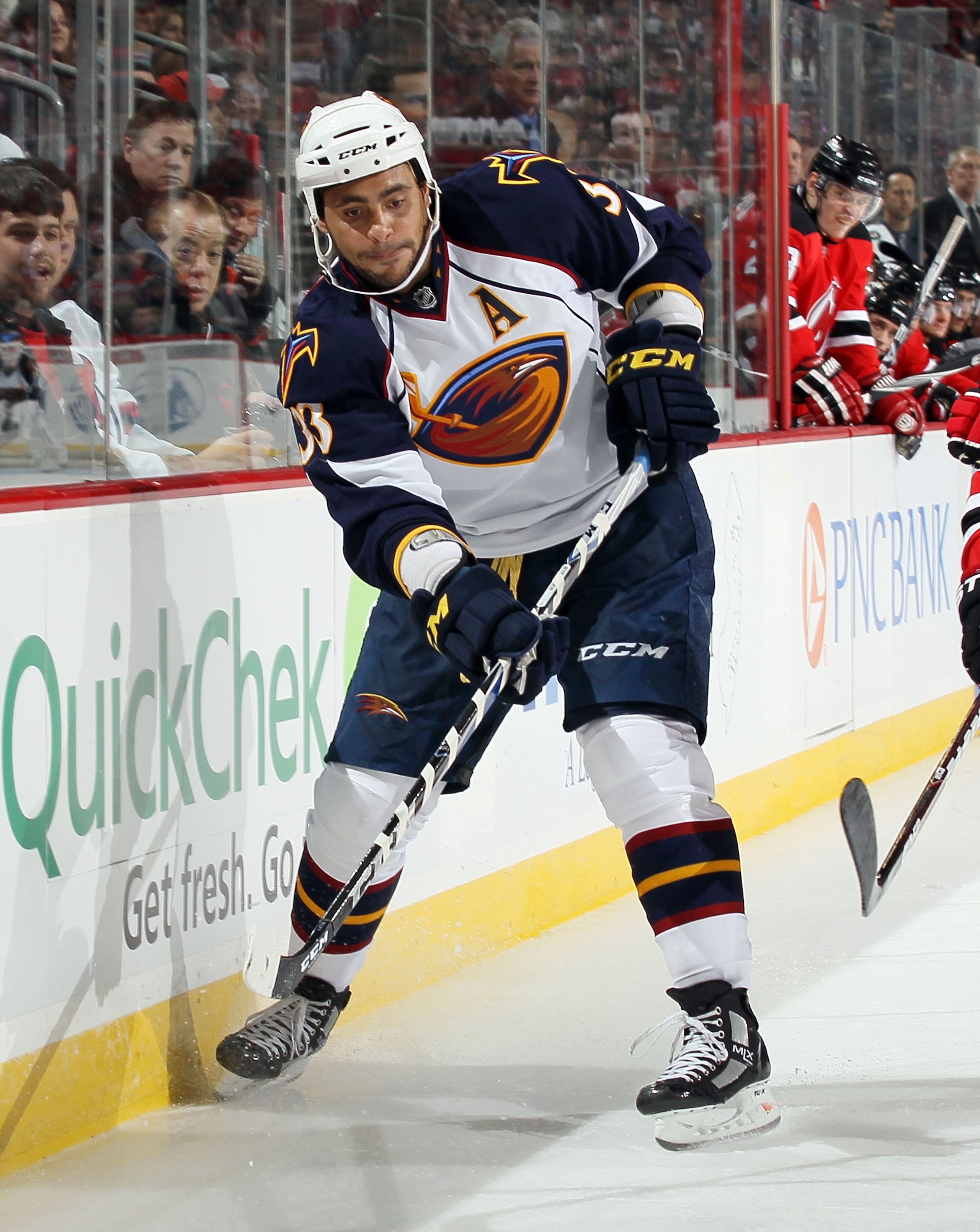 NEWARK, NJ - DECEMBER 31: Dustin Byfuglien #33 of the Atlanta Thrashers skates against the New Jersey Devils at the Prudential Center on December 31, 2010 in Newark, New Jersey. The Devils defeated the Thrashers 3-1. (Photo by Jim McIsaac/Getty Images) NEWARK, NJ - DECEMBER 31: Dustin Byfuglien #33 of the Atlanta Thrashers skates against the New Jersey Devils at the Prudential Center on December 31, 2010 in Newark, New Jersey. The Devils defeated the Thrashers 3-1. (Photo by Jim McIsaac/Getty Images)