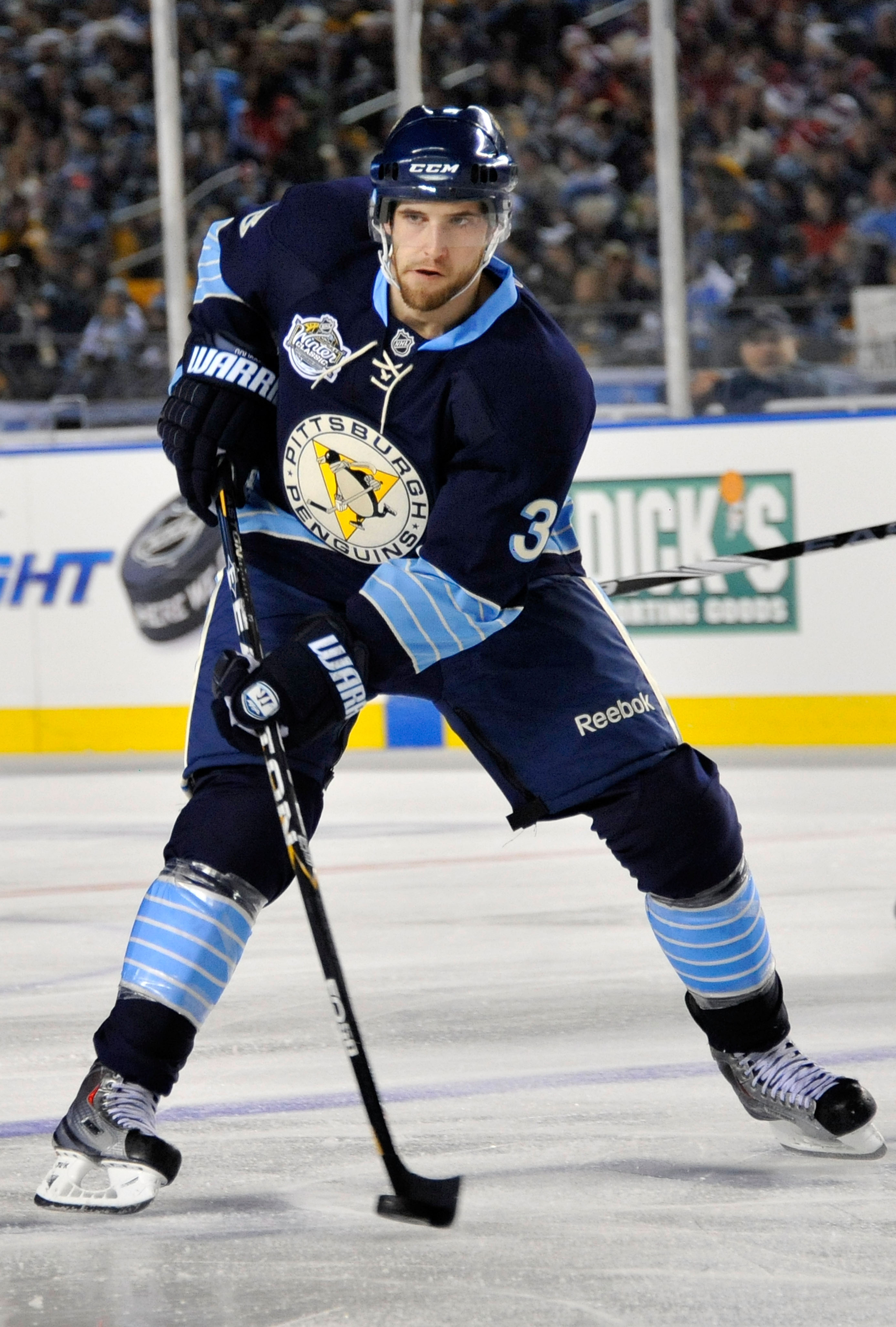 PITTSBURGH, PA - JANUARY 01:  Alex Goligoski #3 of the Pittsburgh Penguins passes against the Washington Capitals during the 2011 NHL Bridgestone Winter Classic at Heinz Field on January 1, 2011 in Pittsburgh, Pennsylvania. Washington won 3-1. (Photo by J