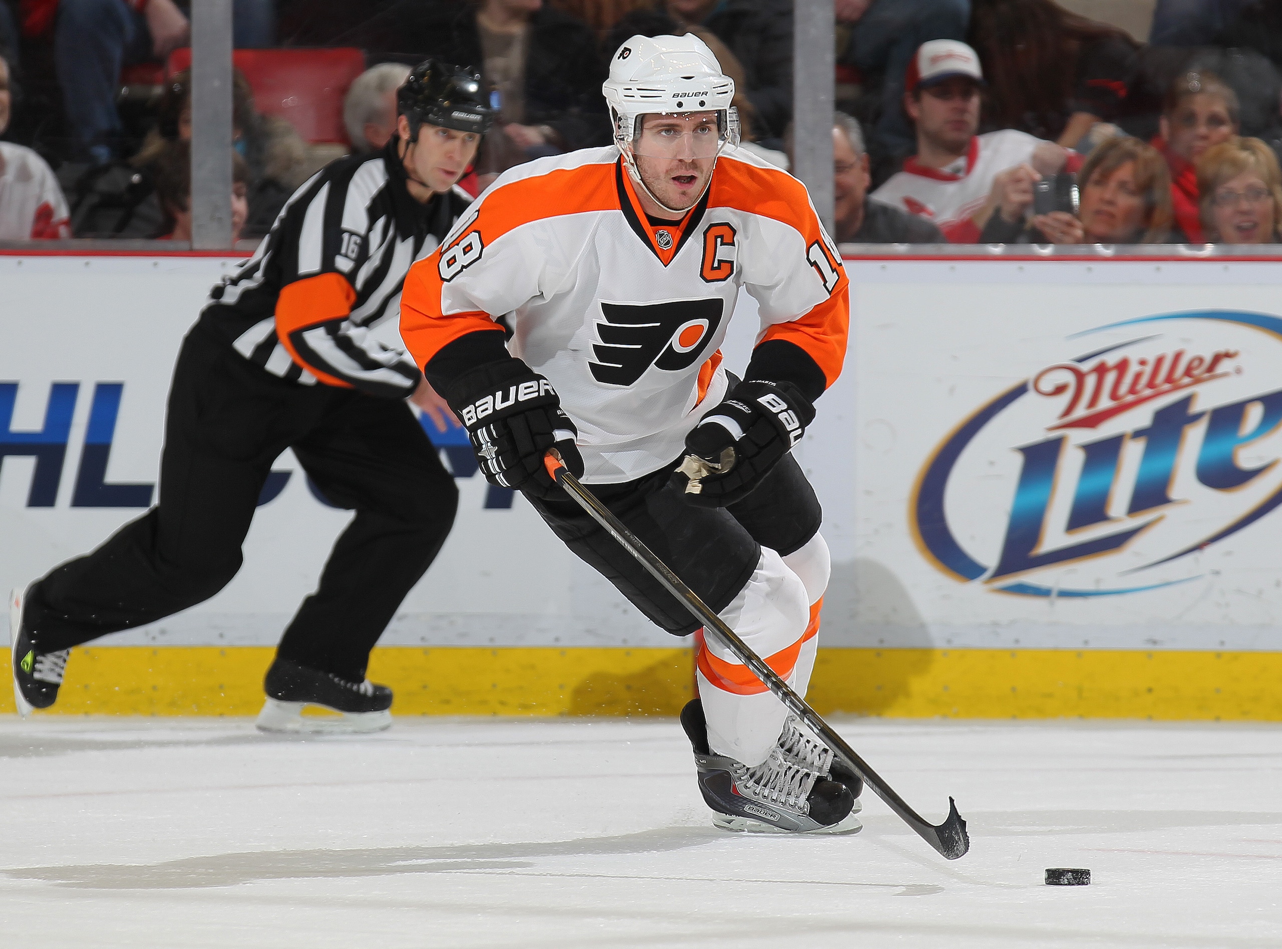 DETROIT, MI - JANUARY 2: Mike Richards #18 of the Philadelphia Flyers skates up ice with the puck in a game against the Detroit Red Wings on January 2, 2011 at the Joe Louis Arena in Detroit, Michigan. The Flyers defeated the Wings 3-2. (Photo by Claus A DETROIT, MI - JANUARY 2: Mike Richards #18 of the Philadelphia Flyers skates up ice with the puck in a game against the Detroit Red Wings on January 2, 2011 at the Joe Louis Arena in Detroit, Michigan. The Flyers defeated the Wings 3-2. (Photo by Claus A