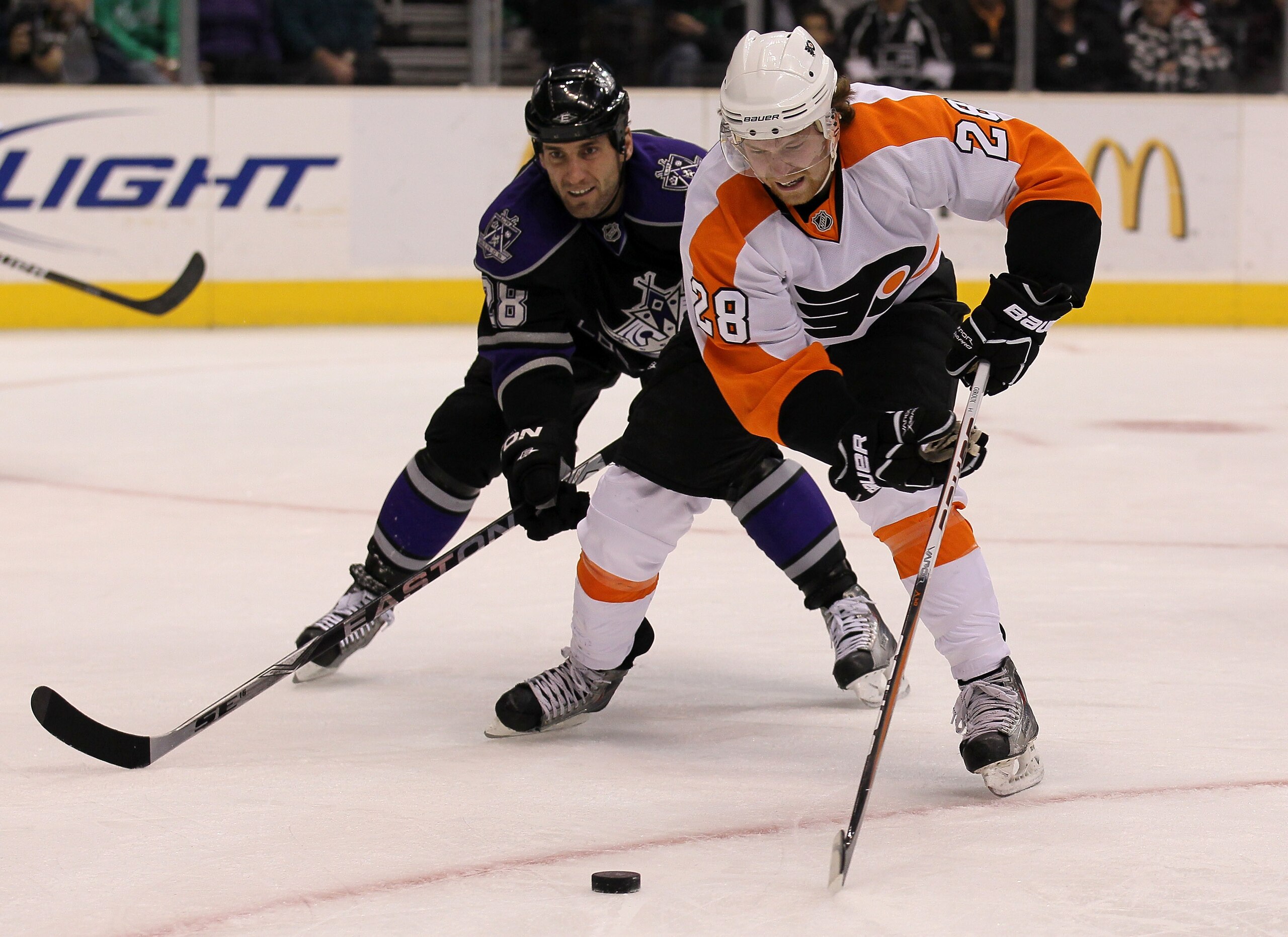 LOS ANGELES, CA - DECEMBER 30: Claude Giroux #28 of the Philadelphia Flyers controls the puck ahead of Jarret Stoll #28 of the Los Angeles Kings at Staples Center on December 30, 2010 in Los Angeles, California. (Photo by Stephen Dunn/Getty Images) LOS ANGELES, CA - DECEMBER 30: Claude Giroux #28 of the Philadelphia Flyers controls the puck ahead of Jarret Stoll #28 of the Los Angeles Kings at Staples Center on December 30, 2010 in Los Angeles, California. (Photo by Stephen Dunn/Getty Images)