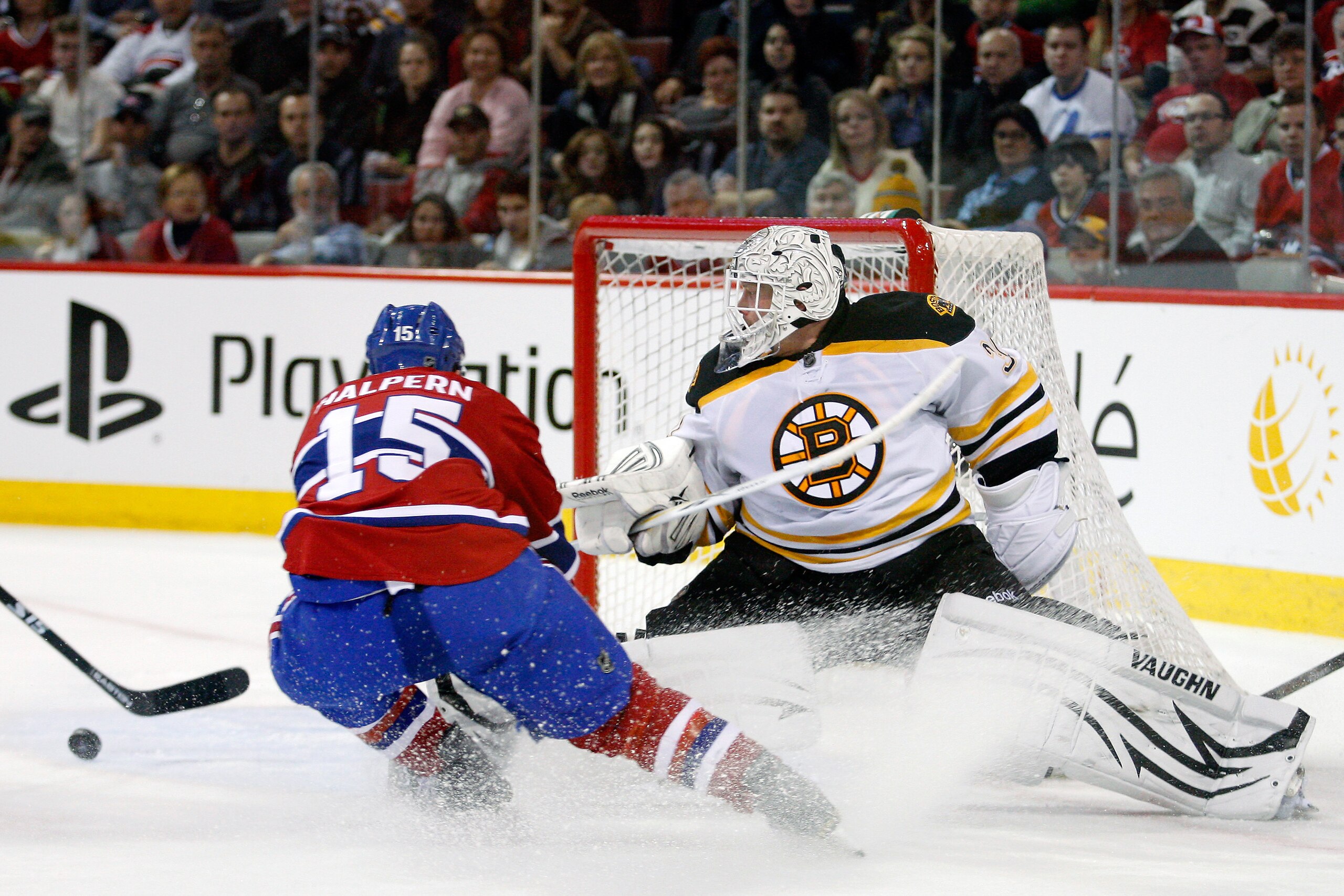 MONTREAL, CANADA - JANUARY 8: Tim Thomas #30 of the Boston Bruins stretches out to stop the puck in front of Jeff Halpern #15 of the Montreal Canadiens during the NHL game at the Bell Centre on January 8, 2011 in Montreal, Quebec, Canada. (Photo by Rich MONTREAL, CANADA - JANUARY 8: Tim Thomas #30 of the Boston Bruins stretches out to stop the puck in front of Jeff Halpern #15 of the Montreal Canadiens during the NHL game at the Bell Centre on January 8, 2011 in Montreal, Quebec, Canada. (Photo by Rich