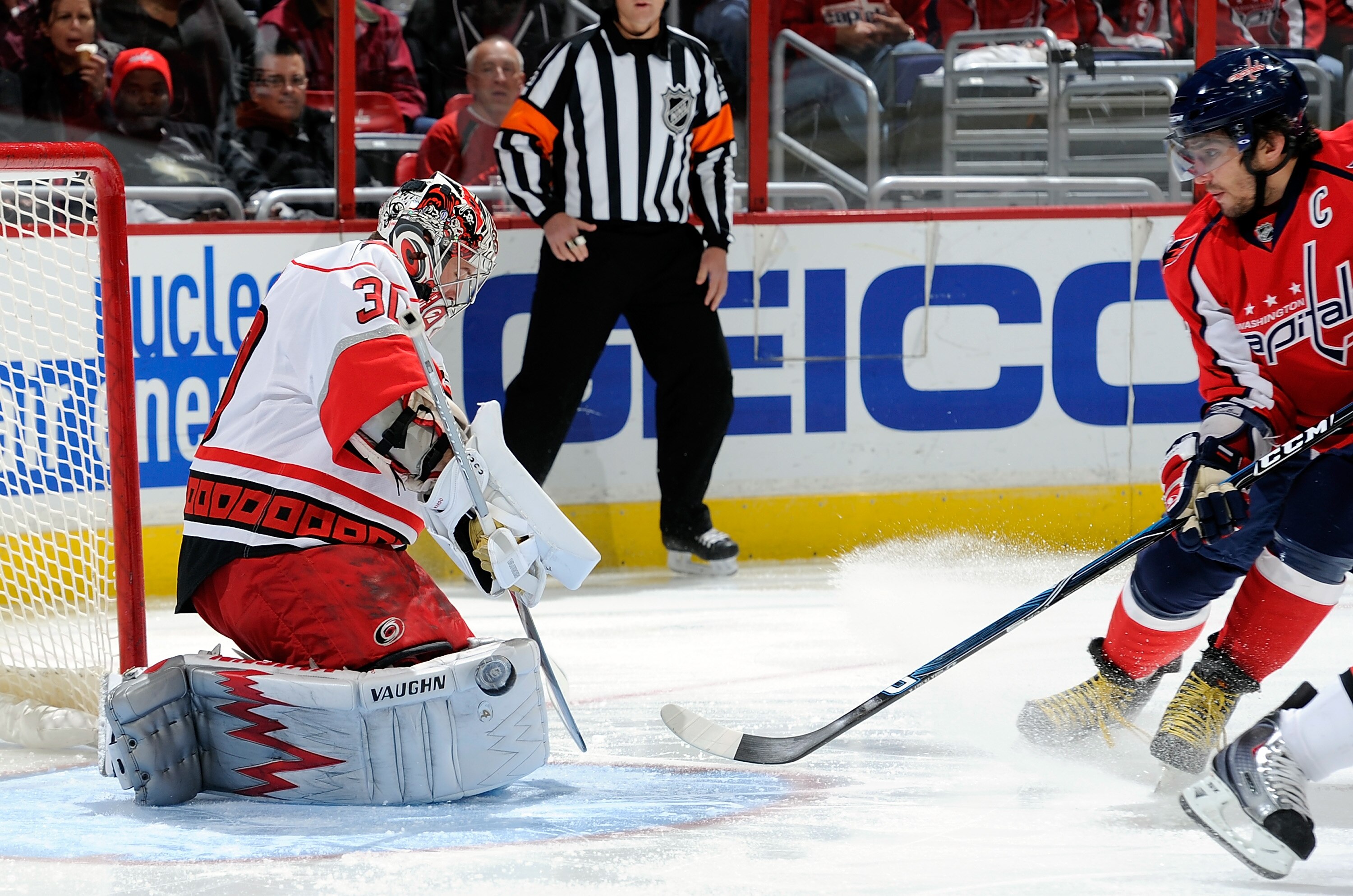 WASHINGTON - NOVEMBER 28:  Cam Ward #30 of the Carolina Hurricanes makes a save against Alex Ovechkin #8 of the Washington Capitals at the Verizon Center on November 28, 2010 in Washington, DC.  (Photo by Greg Fiume/Getty Images)