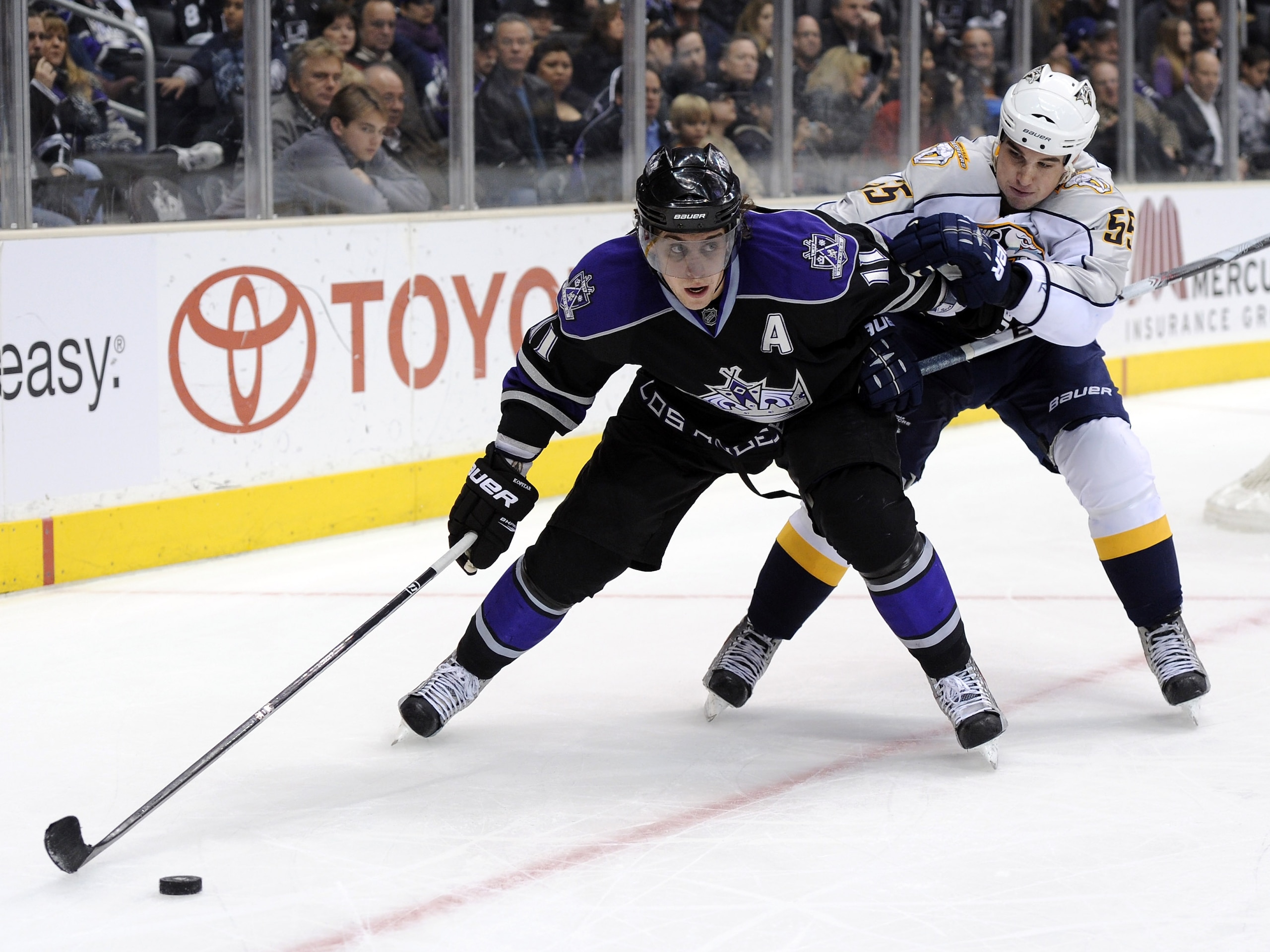 LOS ANGELES, CA - JANUARY 06: Anze Kopitar #11 of the Los Angeles Kings keeps Shane O'Brien #55 of the Nashville Predators from the puck as he looks to make a play during the game at the Staples Center on January 6, 2011 in Los Angeles, California. (Pho LOS ANGELES, CA - JANUARY 06: Anze Kopitar #11 of the Los Angeles Kings keeps Shane O'Brien #55 of the Nashville Predators from the puck as he looks to make a play during the game at the Staples Center on January 6, 2011 in Los Angeles, California. (Pho