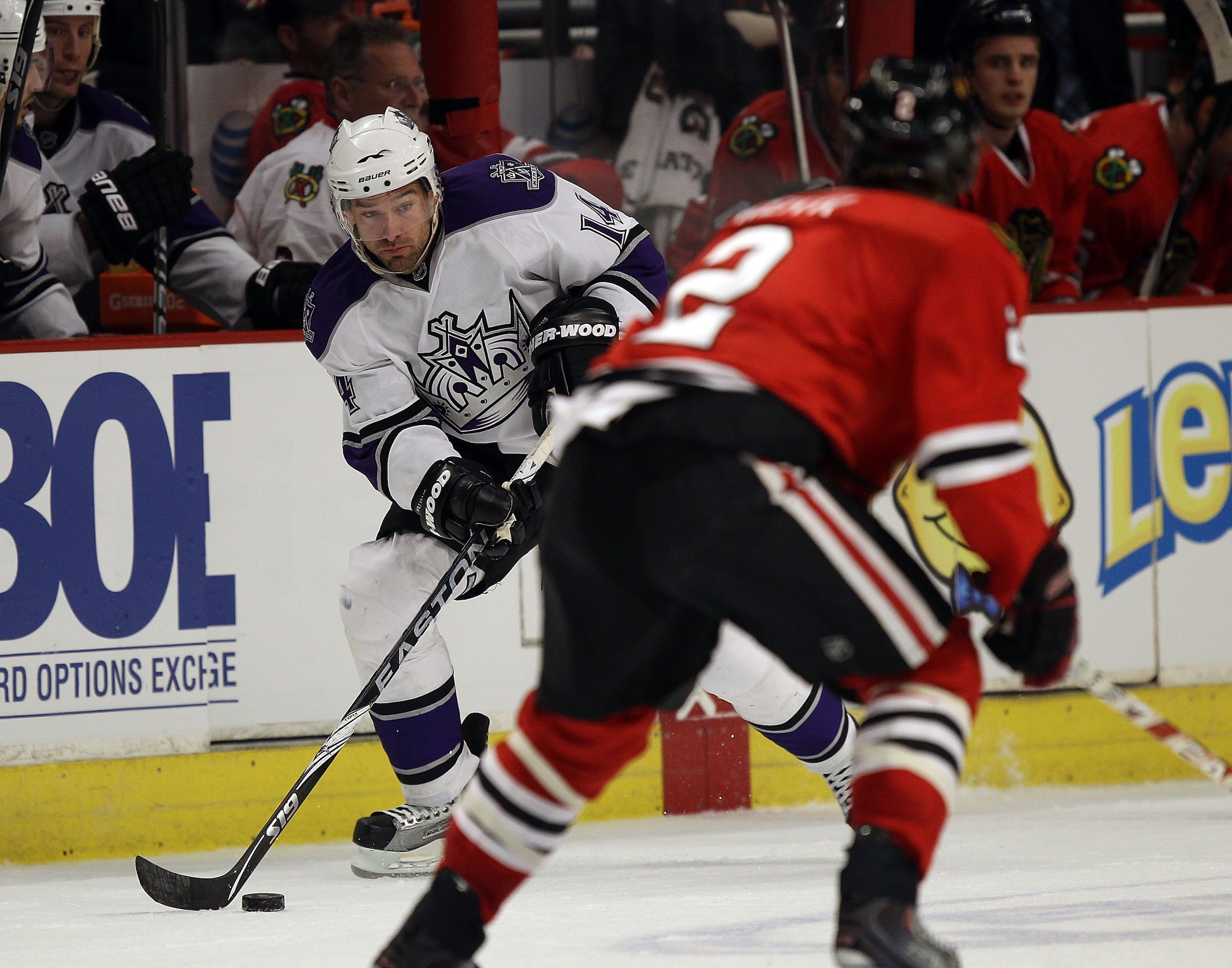 CHICAGO, IL - DECEMBER 19: Justin Williams #14 of the Los Angeles Kings passes the puck near Duncan Keith #2 of the Chicago Blackhawks at the United Center on December 19, 2010 in Chicago, Illinois. The Blackhawks defeated the Kings 3-2. (Photo by Jonatha CHICAGO, IL - DECEMBER 19: Justin Williams #14 of the Los Angeles Kings passes the puck near Duncan Keith #2 of the Chicago Blackhawks at the United Center on December 19, 2010 in Chicago, Illinois. The Blackhawks defeated the Kings 3-2. (Photo by Jonatha
